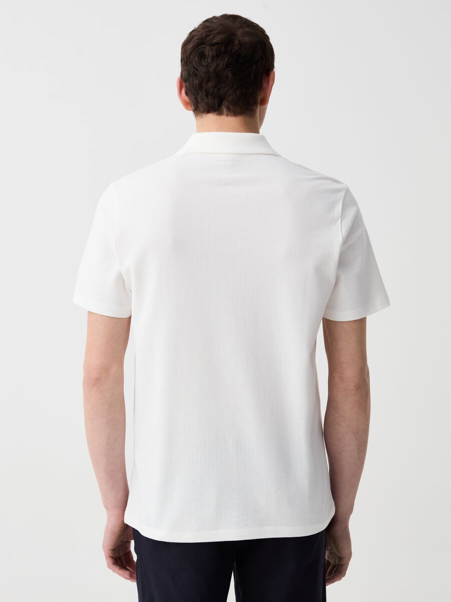 Organic cotton polo shirt with textured weave_1