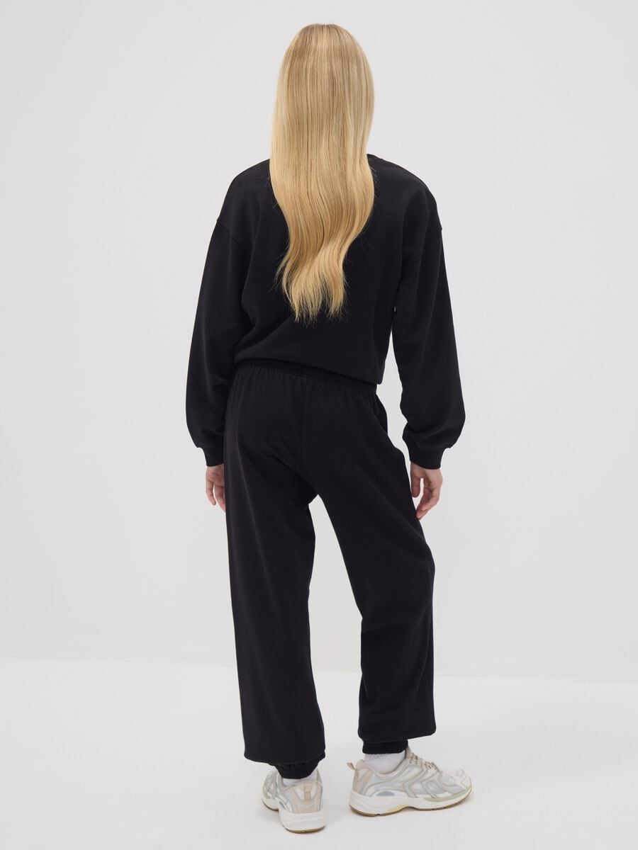 Black organic cotton-blend jogger trousers with printed detail for girls_1