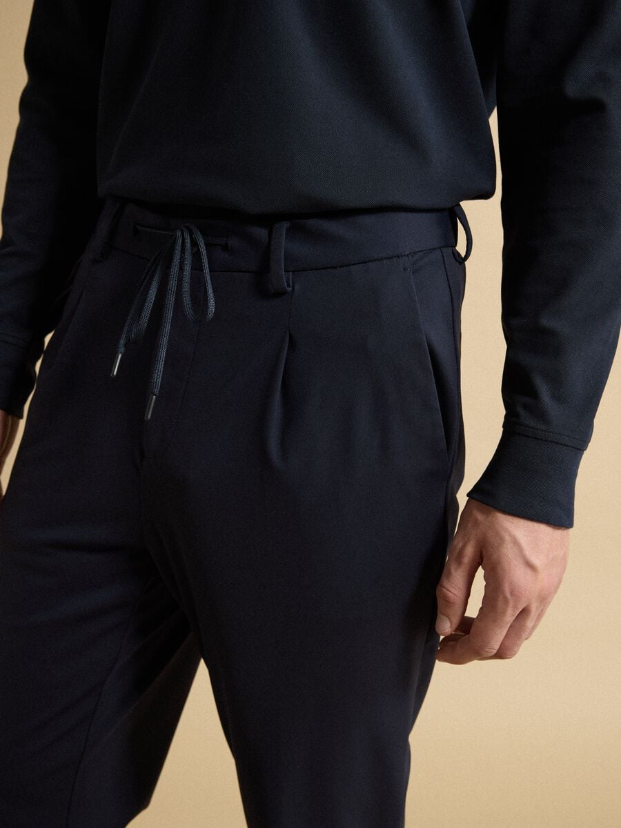 Blue 4-way stretch regular-fit trousers with Easy Iron finish_2