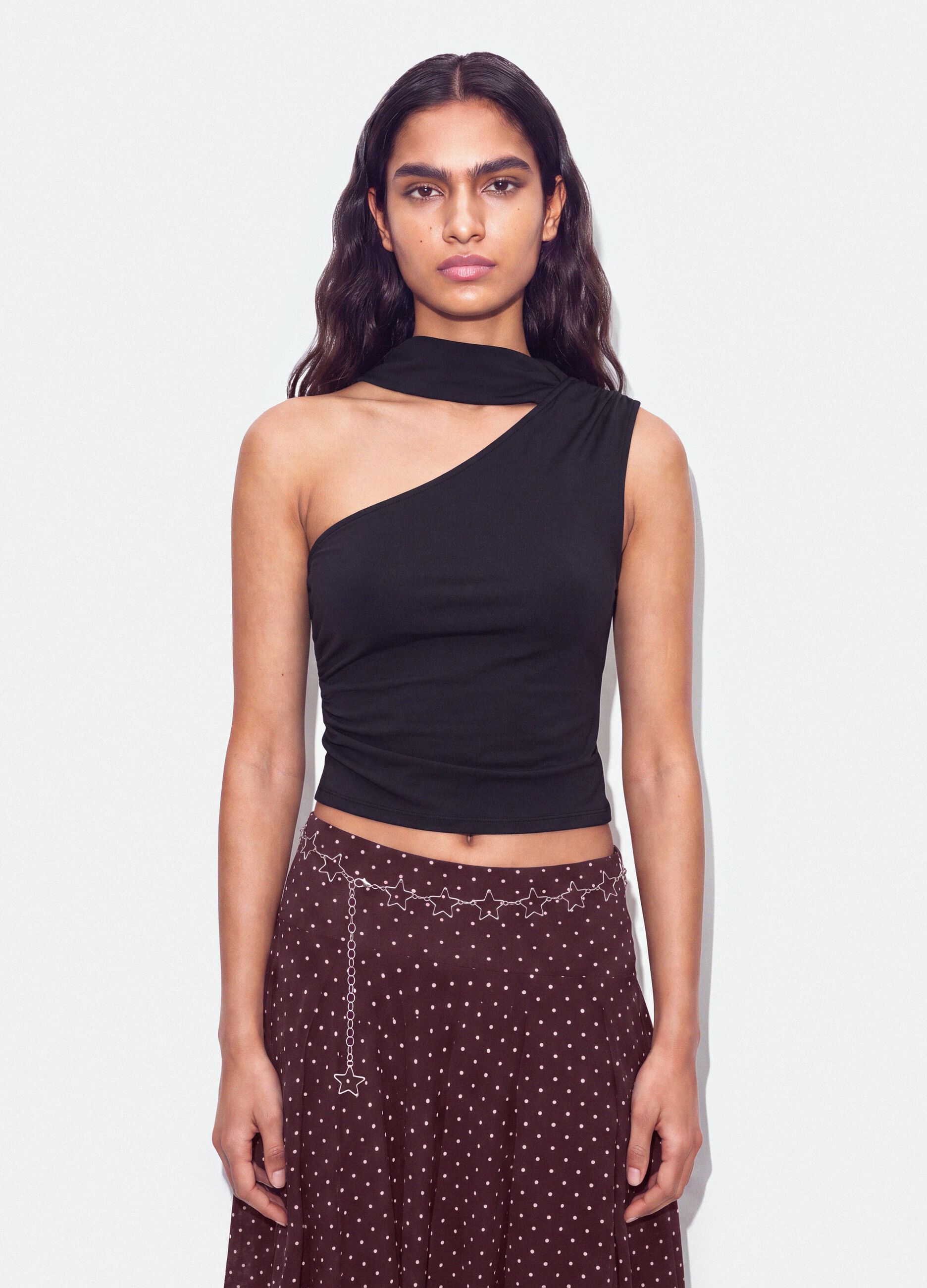 Black stretch top with asymmetric neckline and draped band