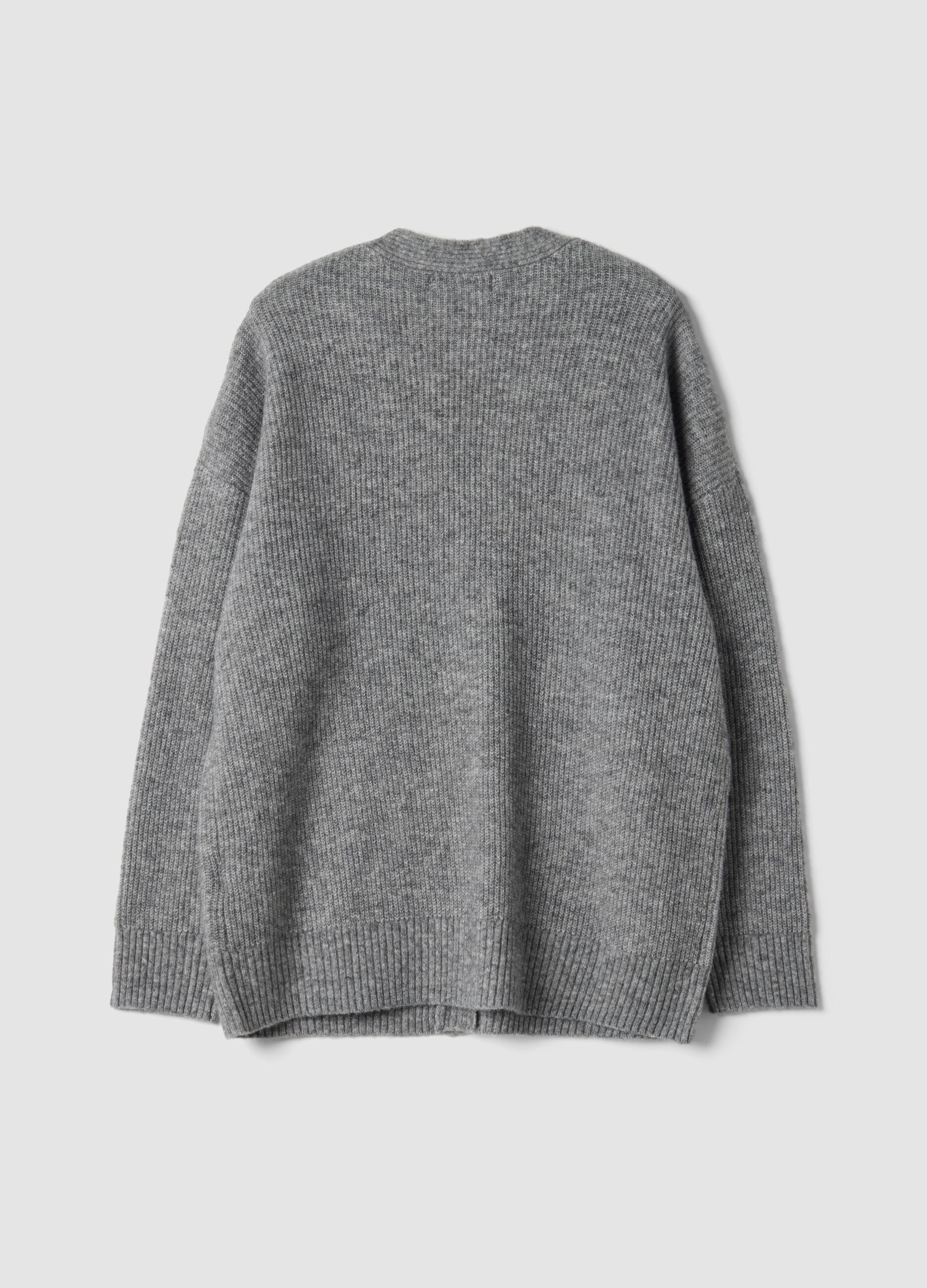 Cardigan grigio in tessuto elasticizzato con scollo profondo a V