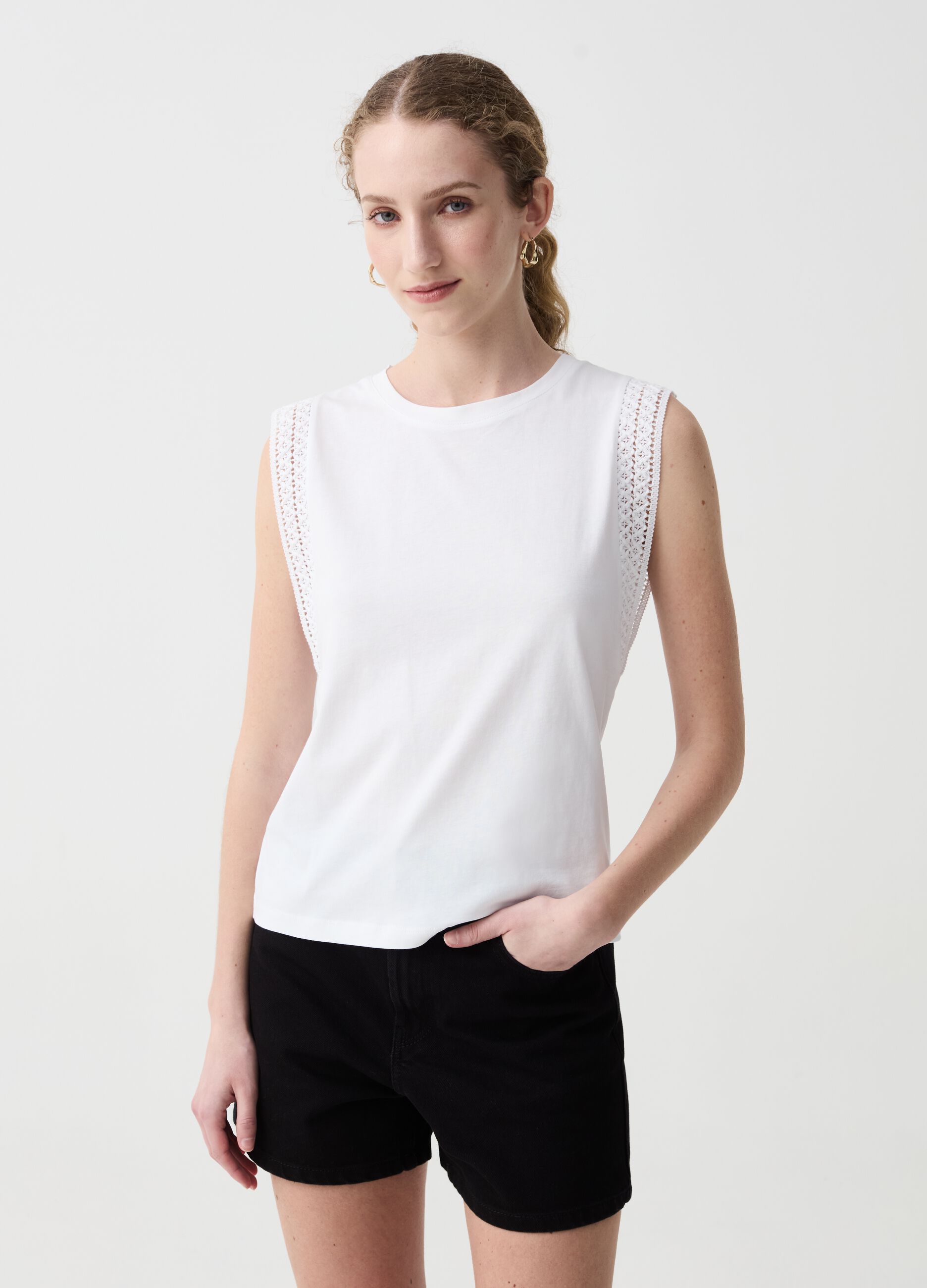 Sleeveless top with embroidered trims