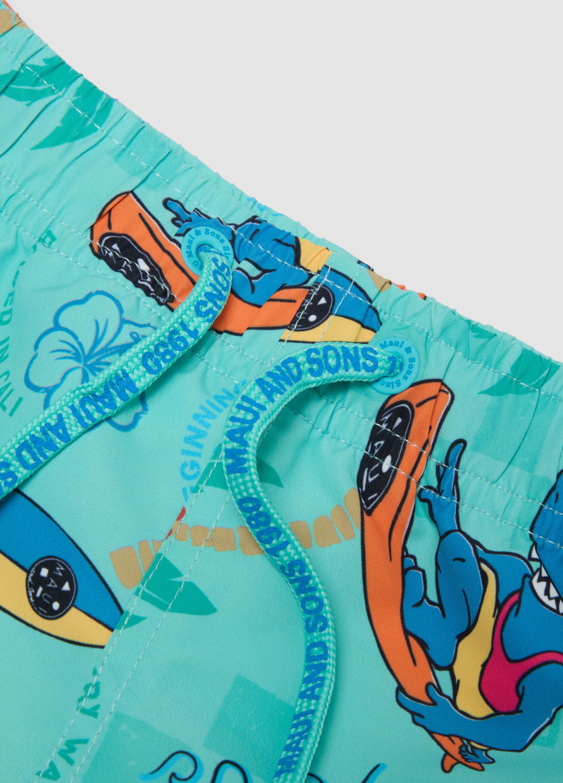 Blue boys&rsquo; swim shorts with tropical print