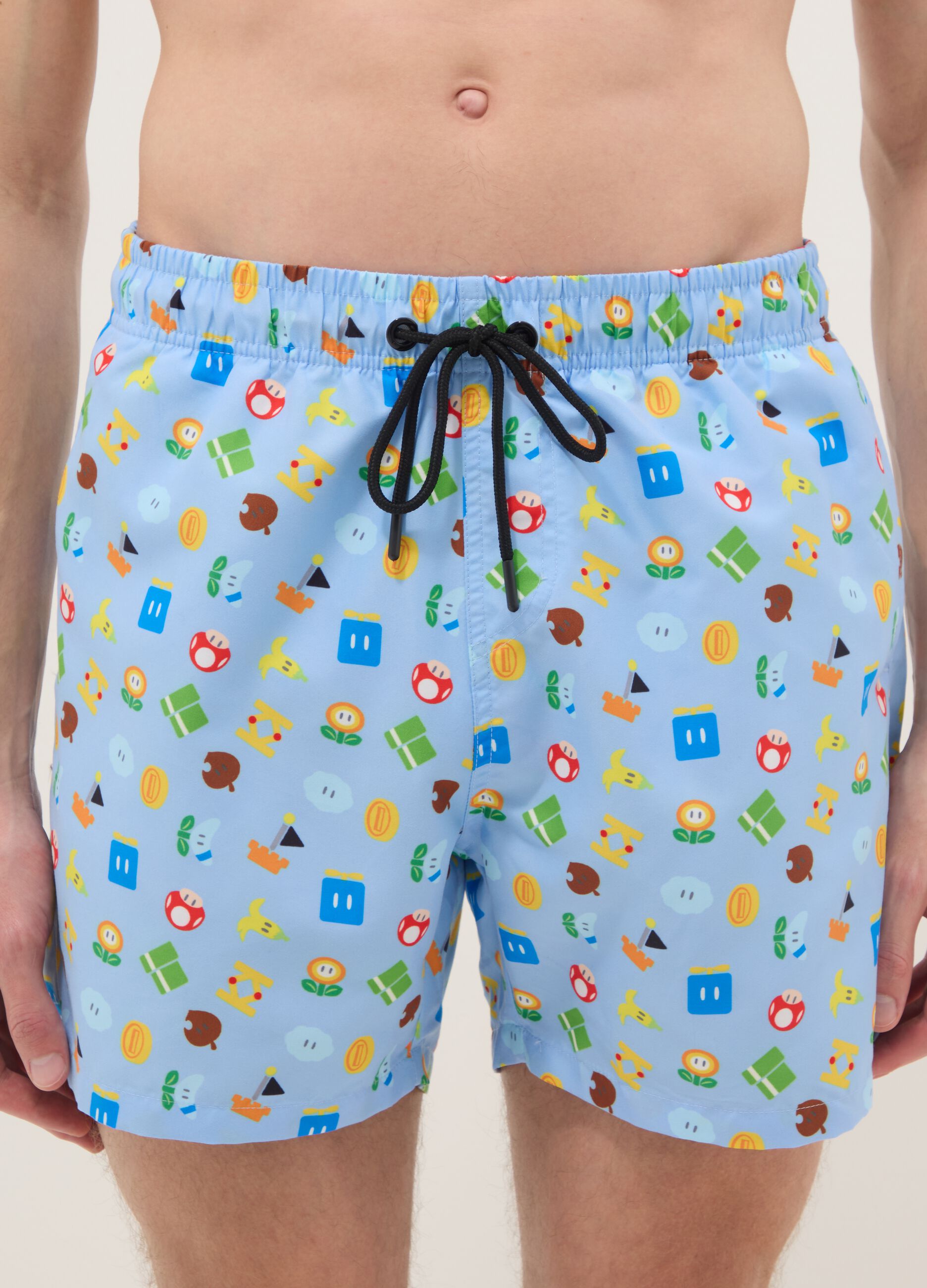Blue swim shorts with Super Mario prints