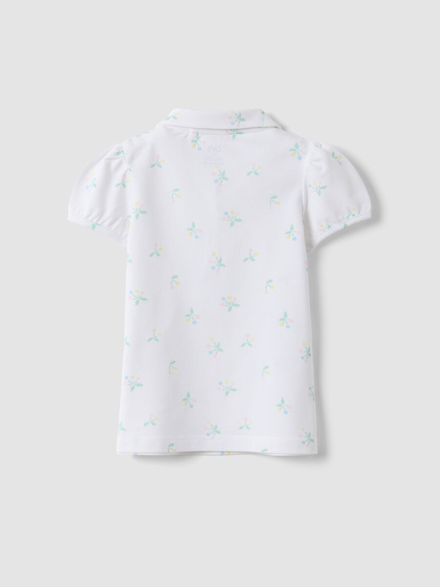 Girls' white cotton polo regular fit with floral pattern_1