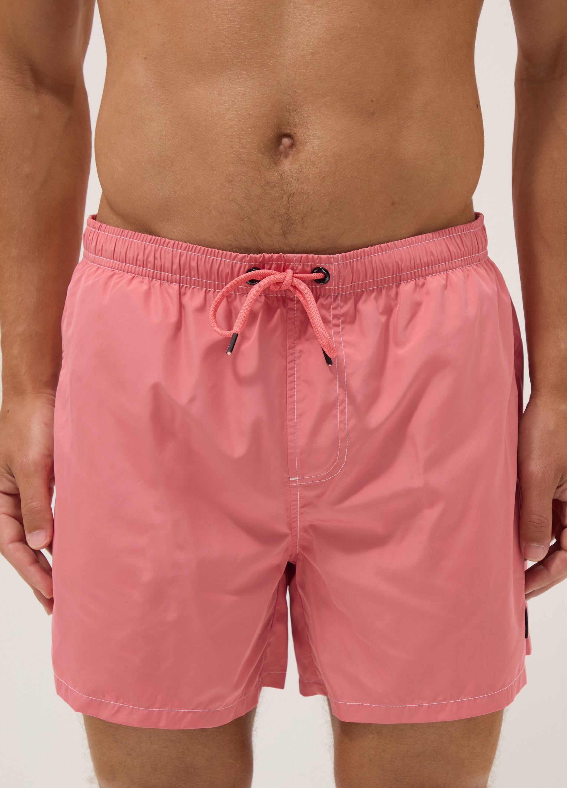 Pink swim shorts with elasticated waist