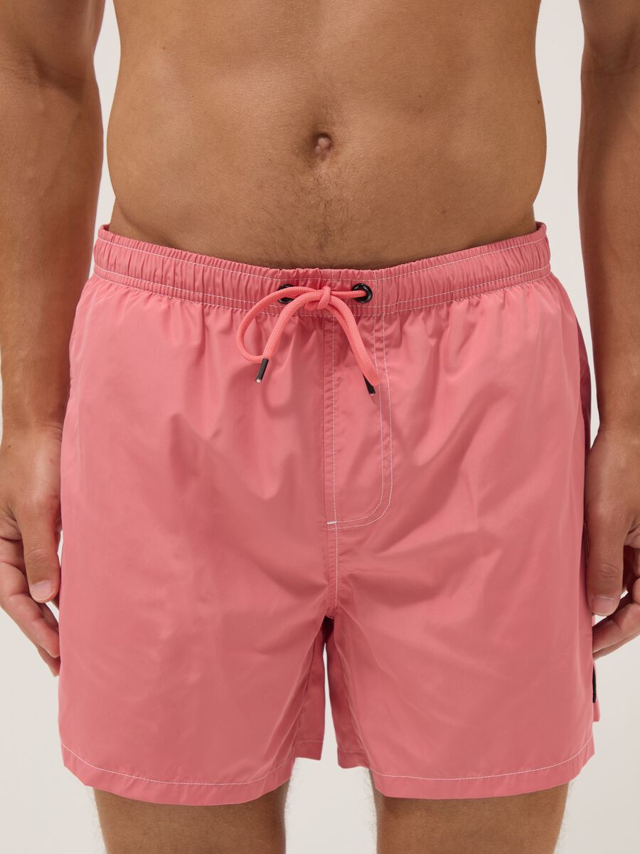 Pink swim shorts with elasticated waist_1