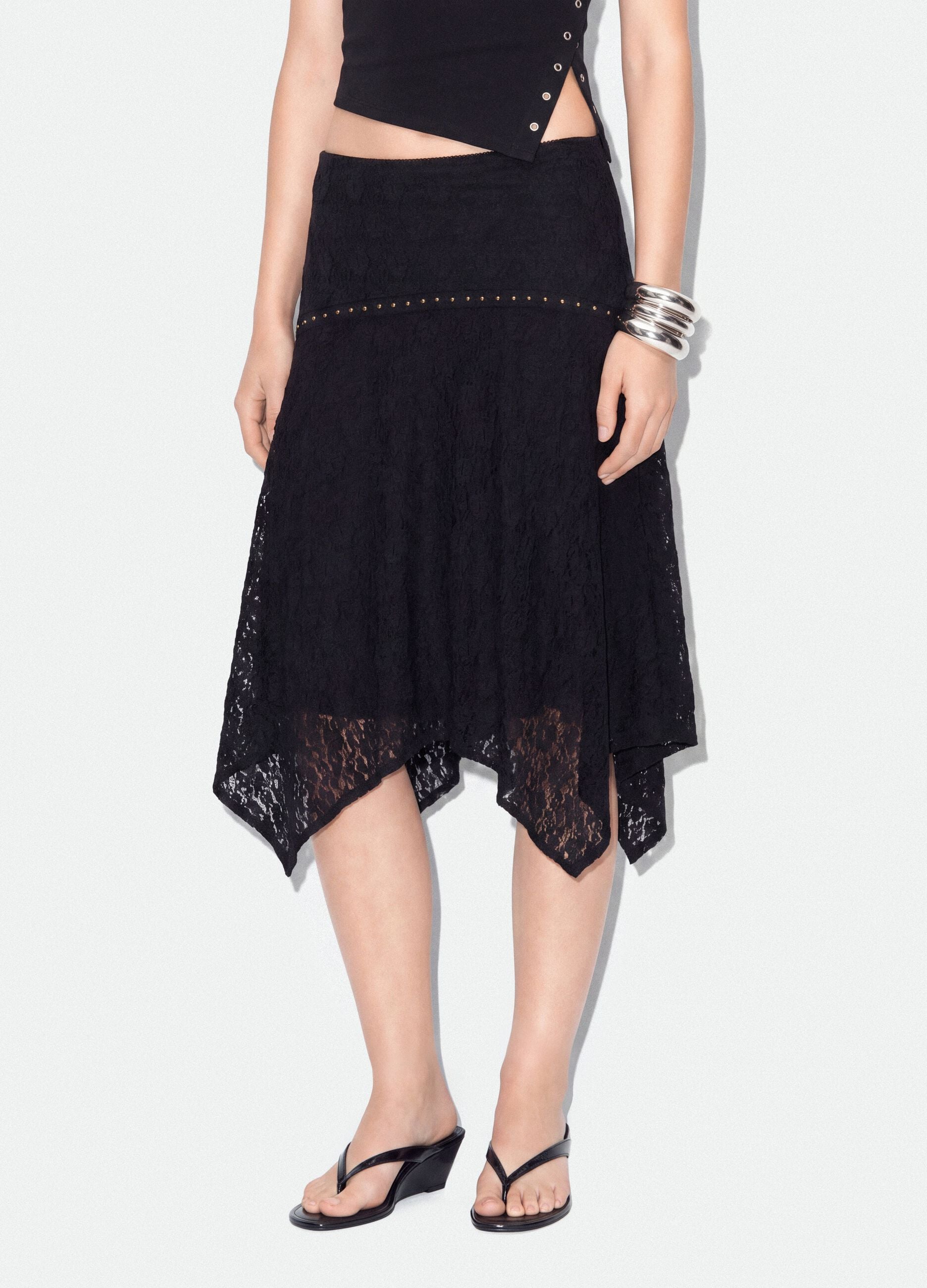 Black stretch skirt with asymmetric lace hem