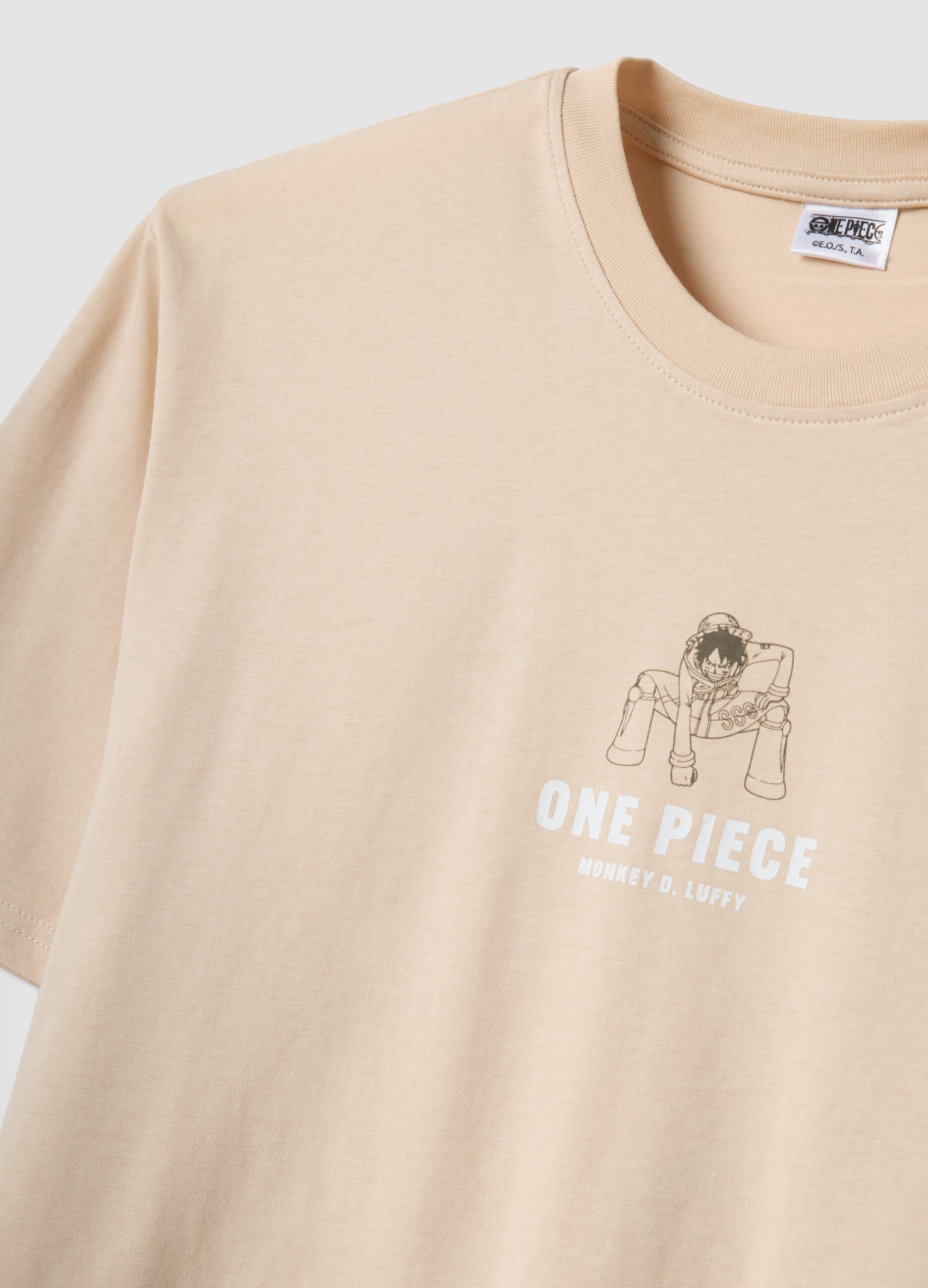 Beiges T-Shirt aus reiner Baumwolle mit One-Piece-Print, Relaxed Fit
