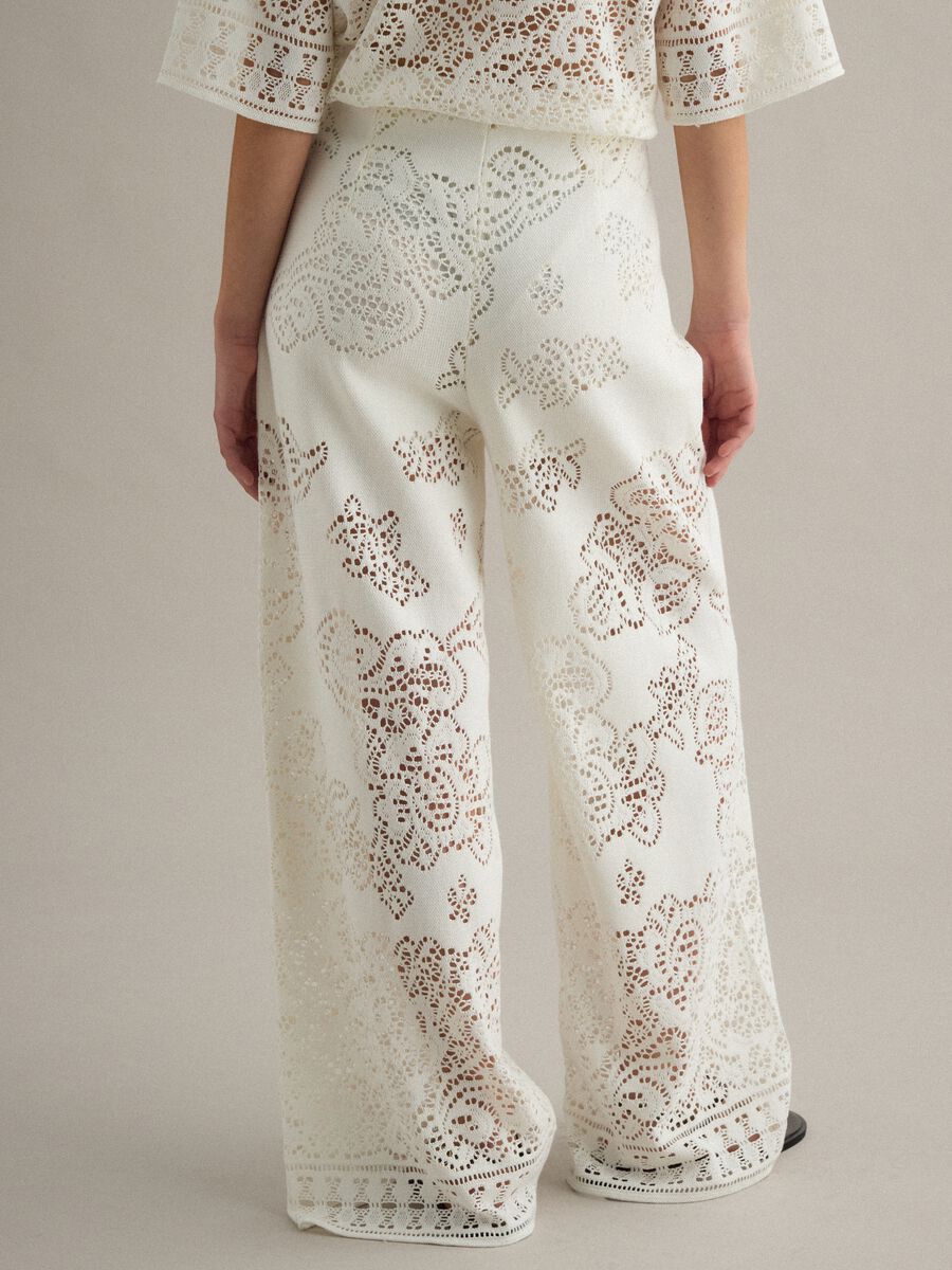 White wide leg cotton blend trousers with perforated texture_3