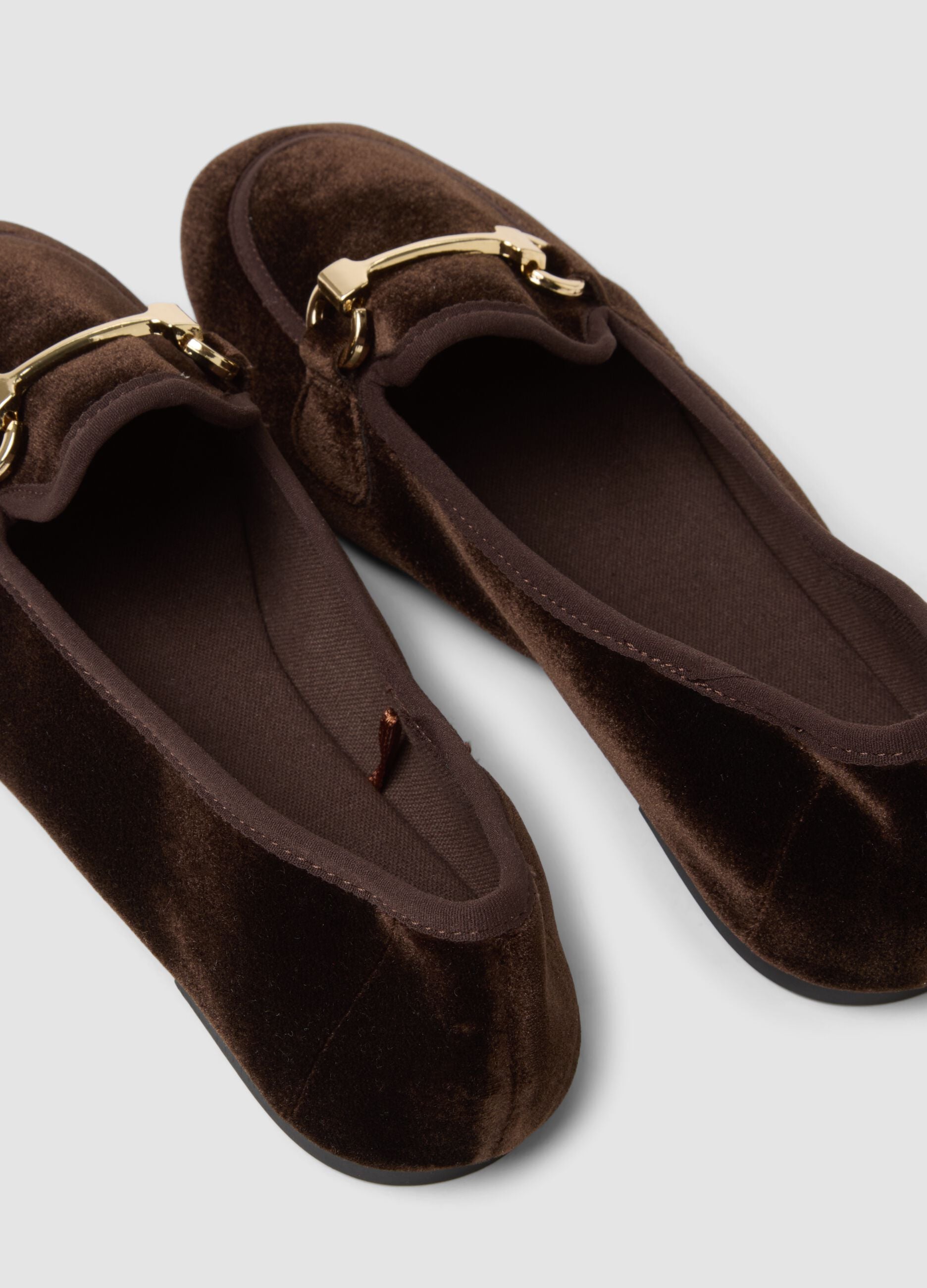 Brown loafers with gold-tone horsebit