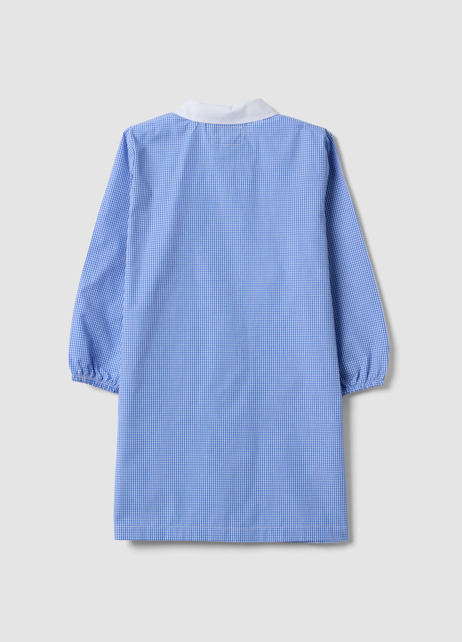 Blue gingham nursery apron with zip and animal embroidery