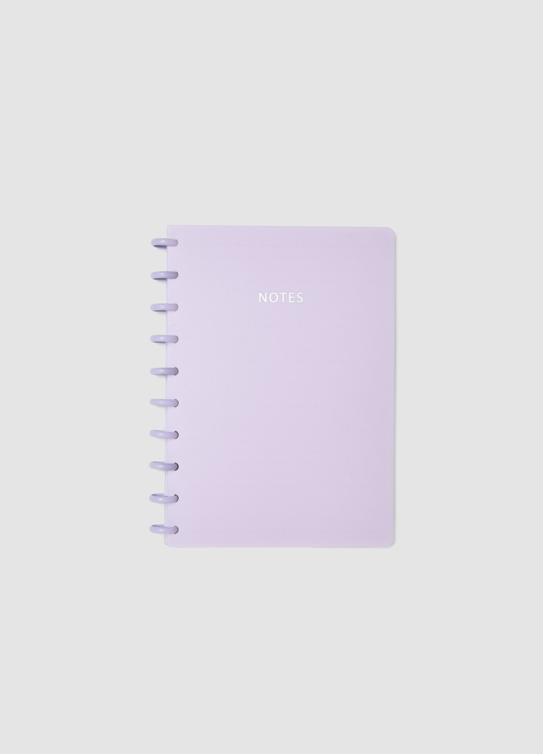Purple notebook with lined pages in rigid cardboard with spiral