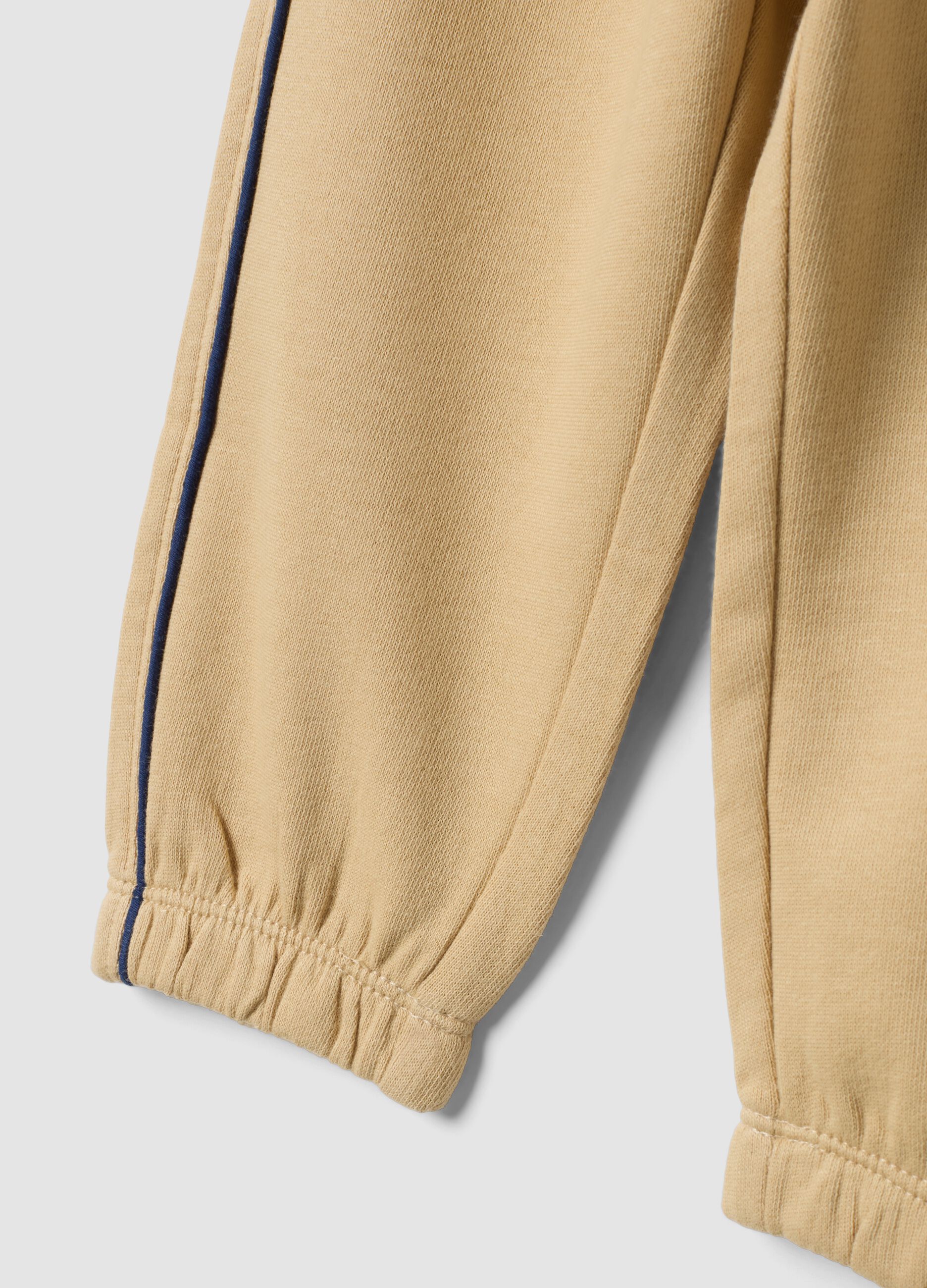 Beige pure cotton joggers with print