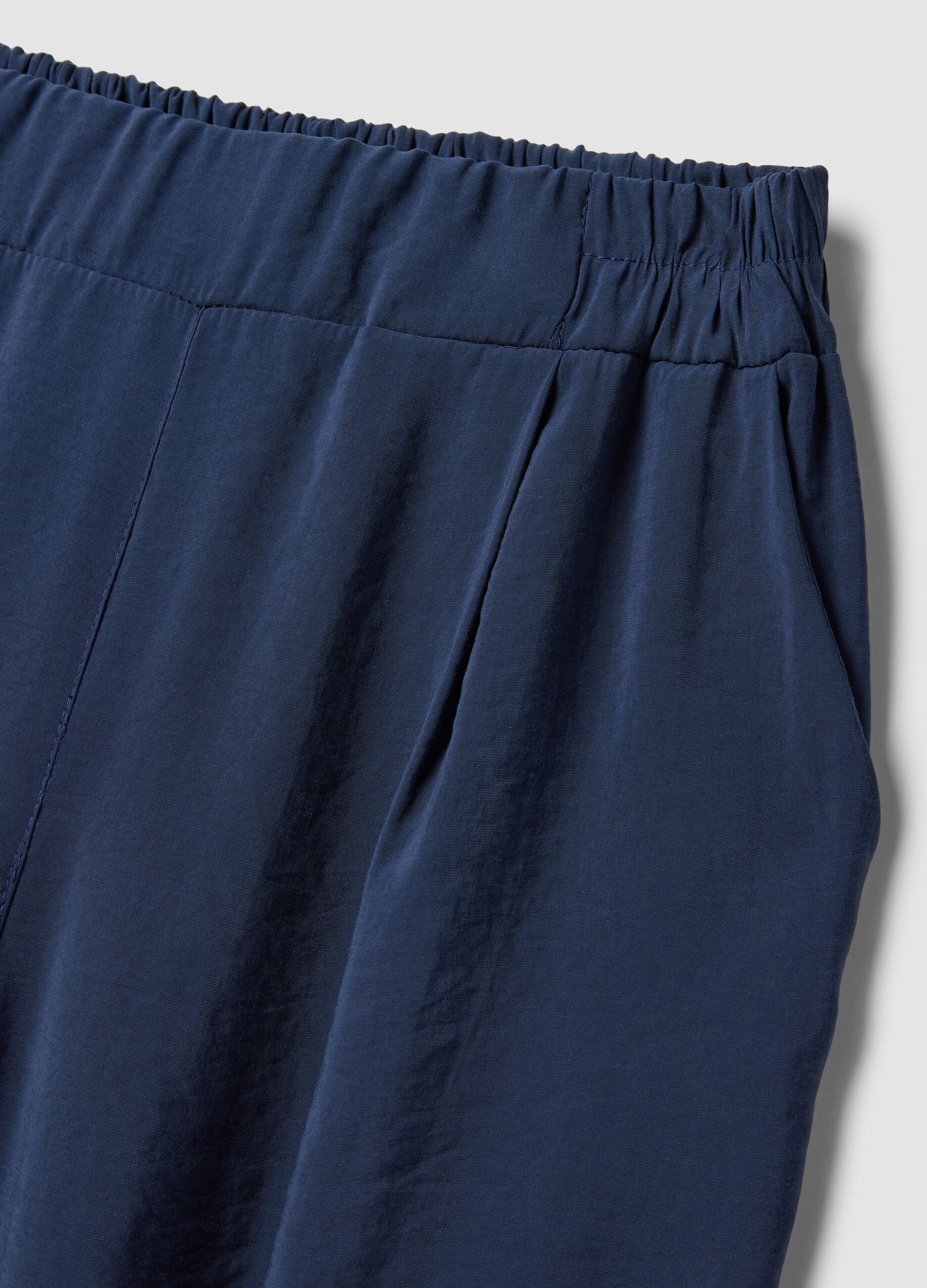 Blue viscose-blend trousers with elasticated cuffs, regular fit
