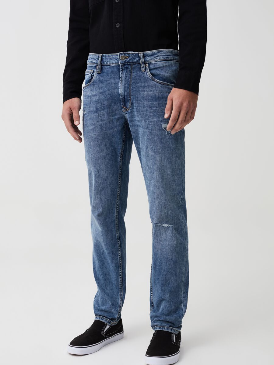 Slim-fit jeans with abrasions and fading_1