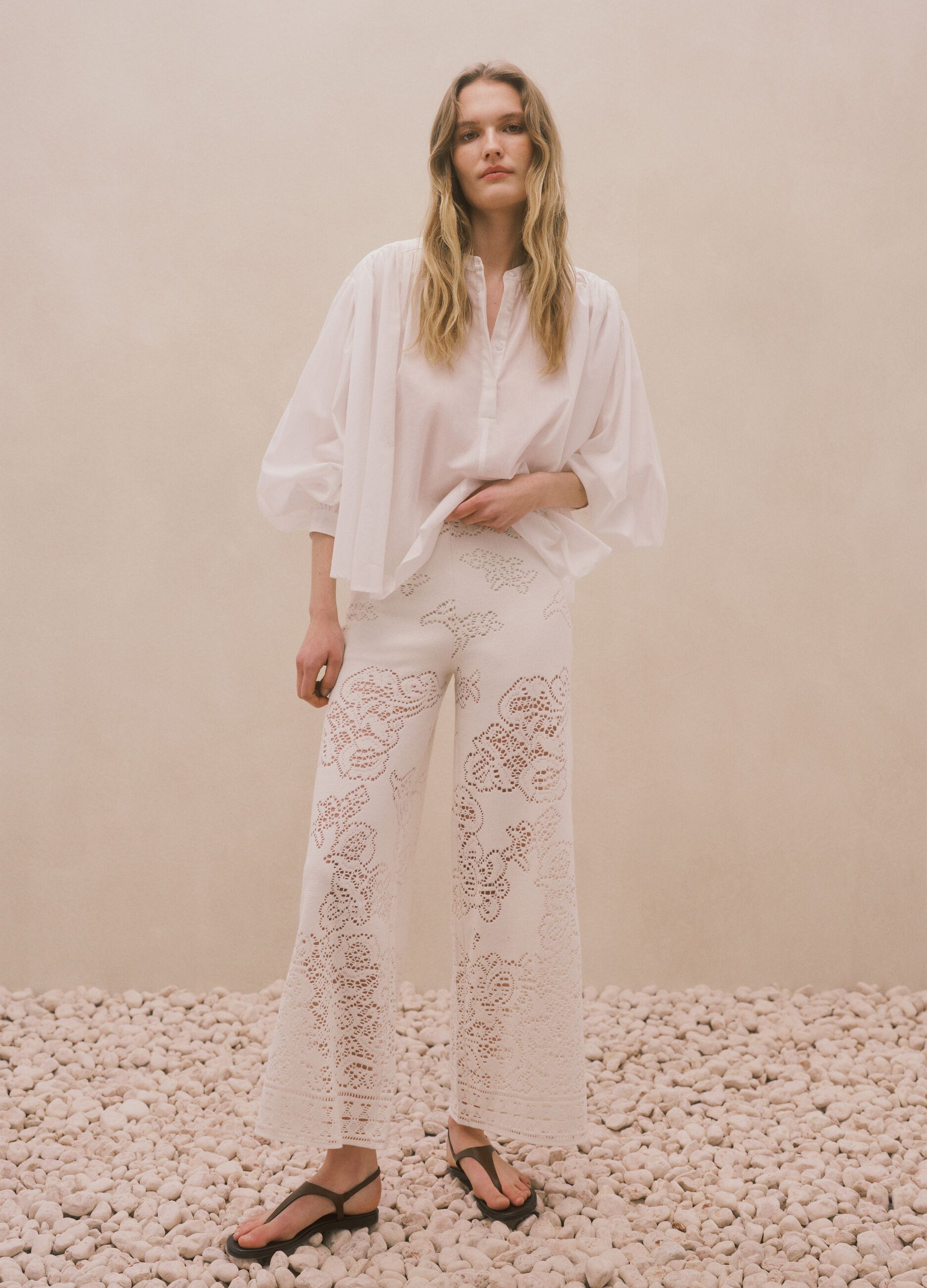 White wide leg cotton blend trousers with perforated texture