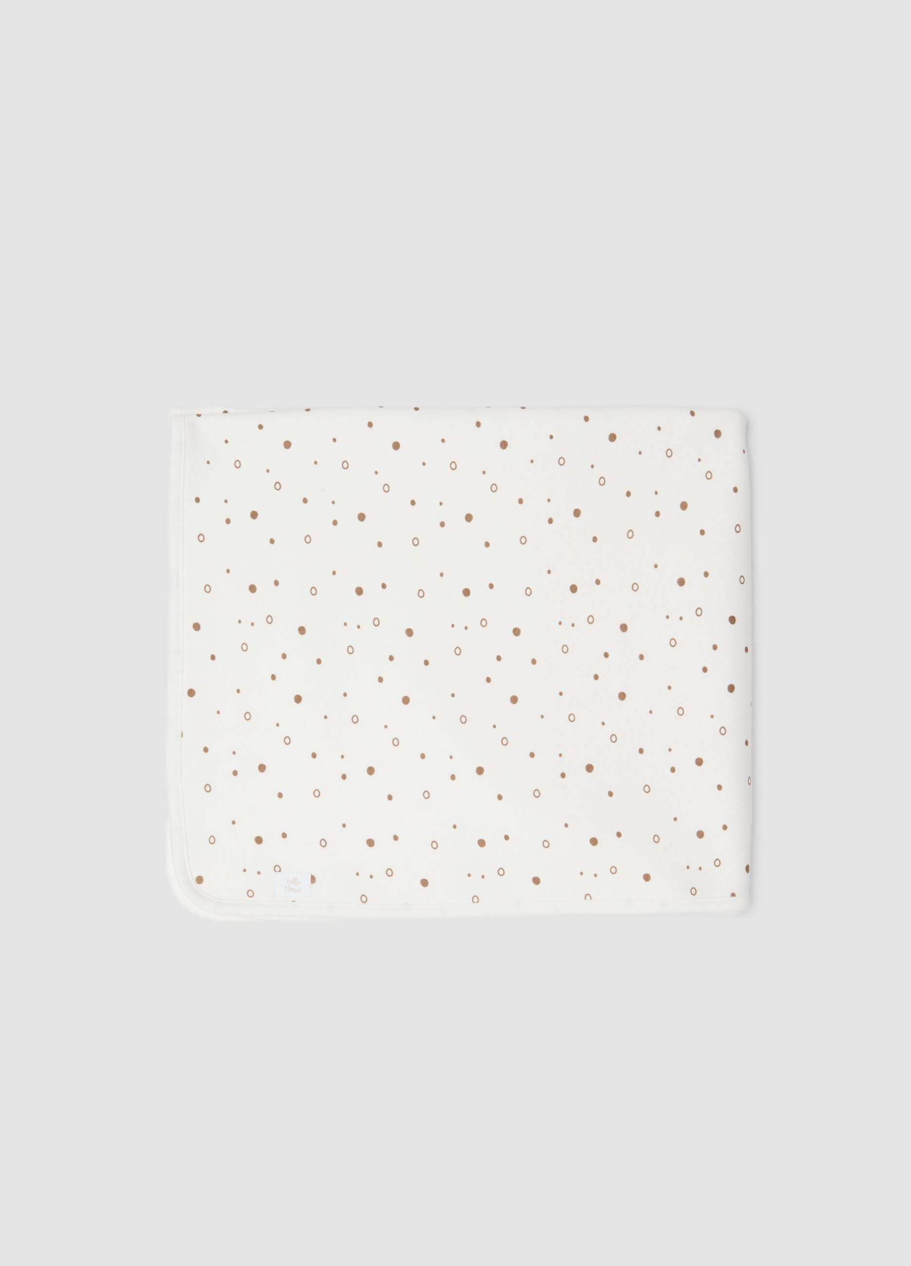 White organic cotton blend baby blanket with polka dots
