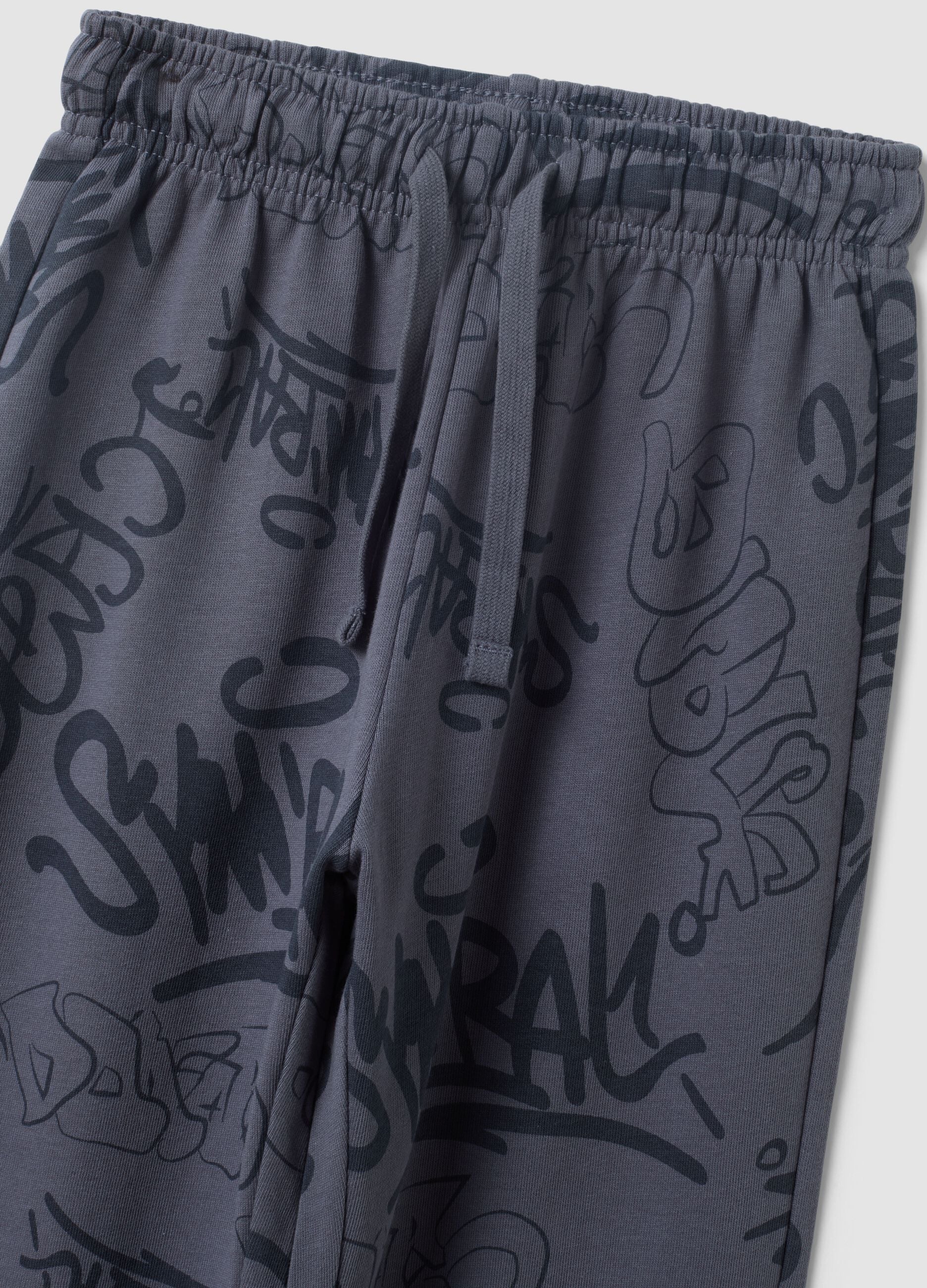 Grey oversized cotton jogger trousers with all-over print for boys