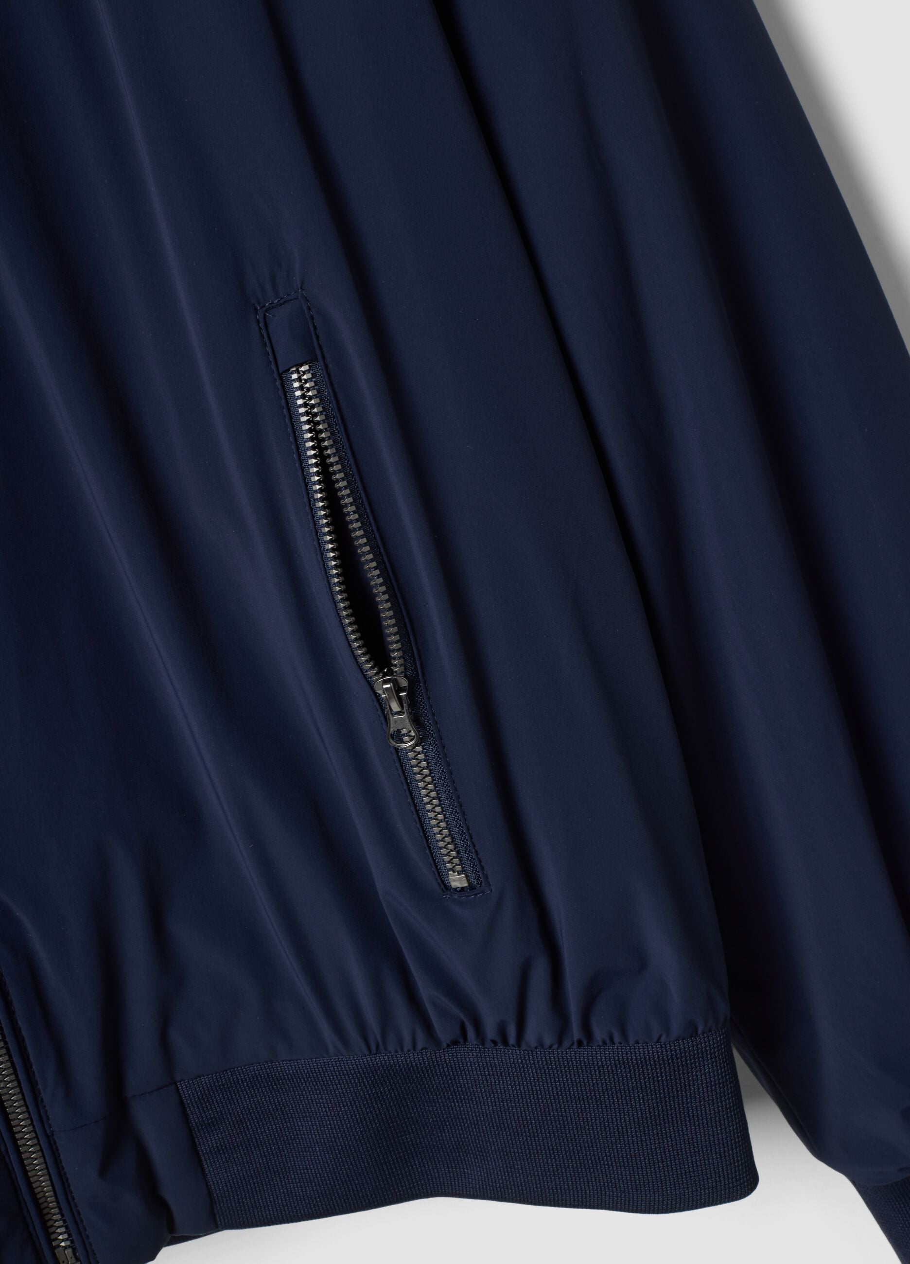 Giubbotto blu in tessuto elasticizzato con zip