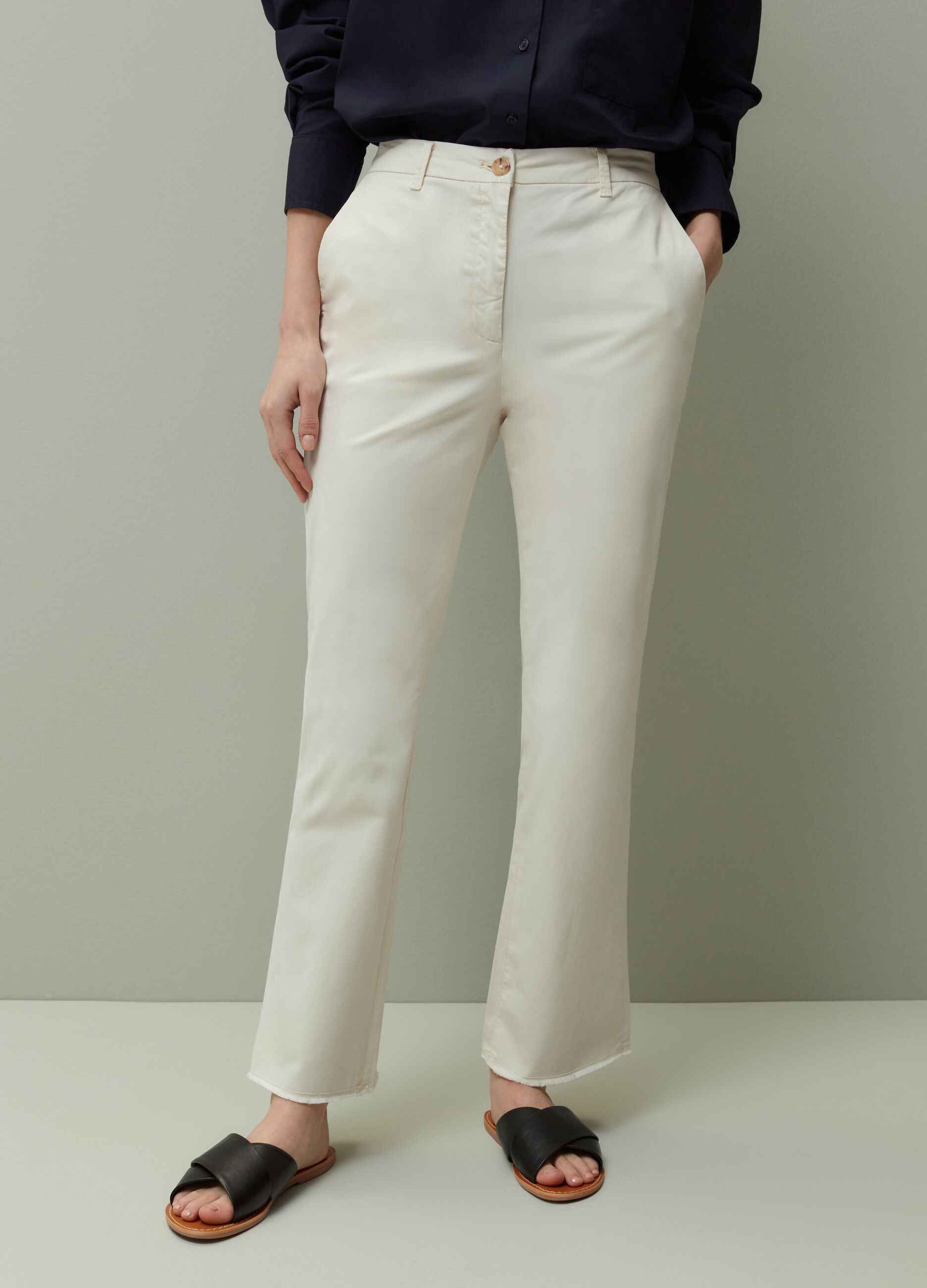 Flared trousers with raw hems