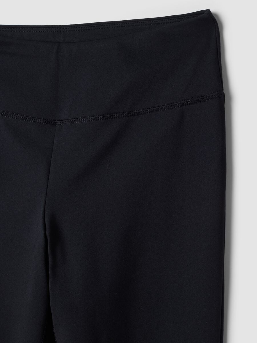 Blue flared leggings in stretchy fabric_7