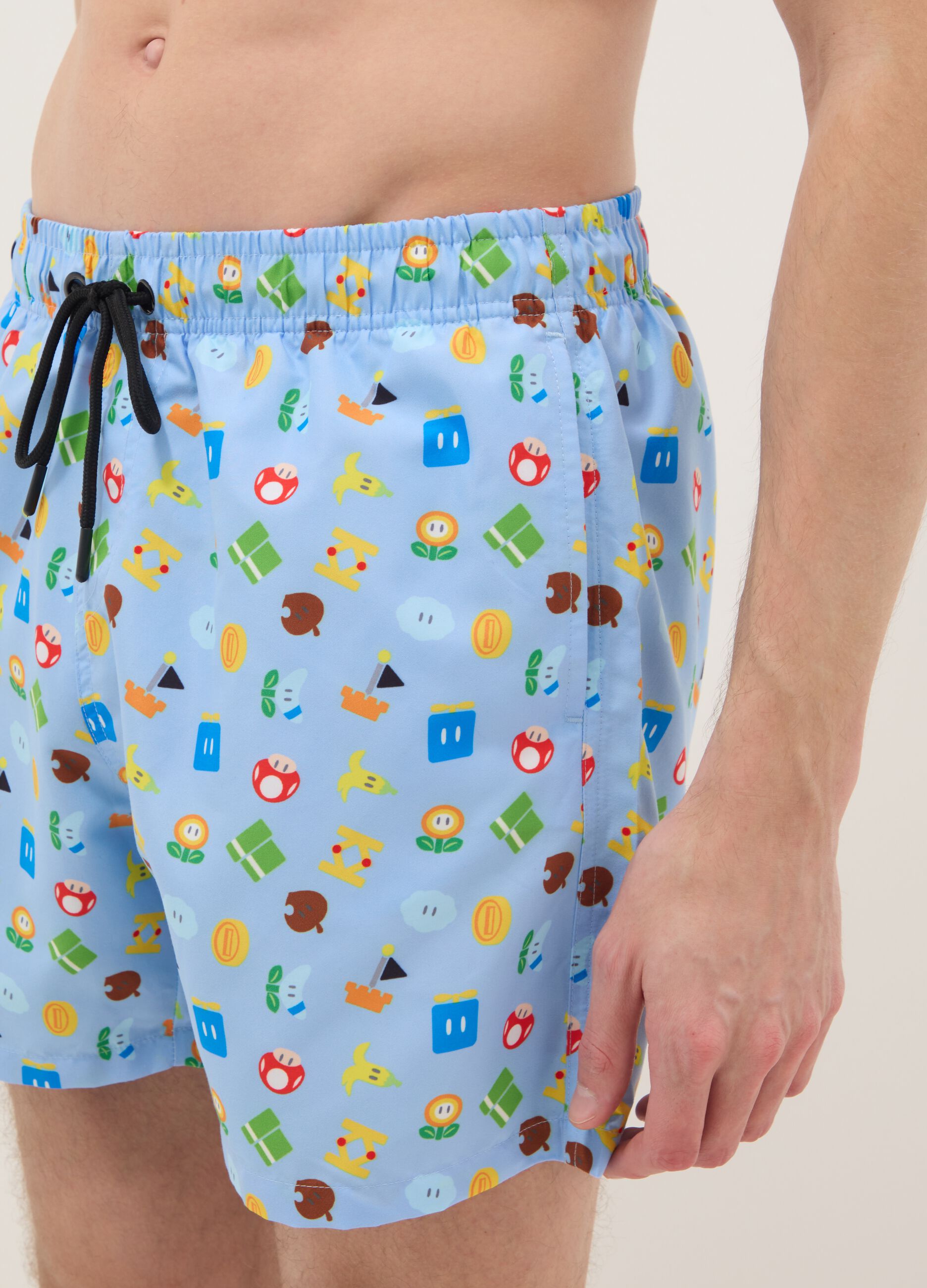 Blue swim shorts with Super Mario prints