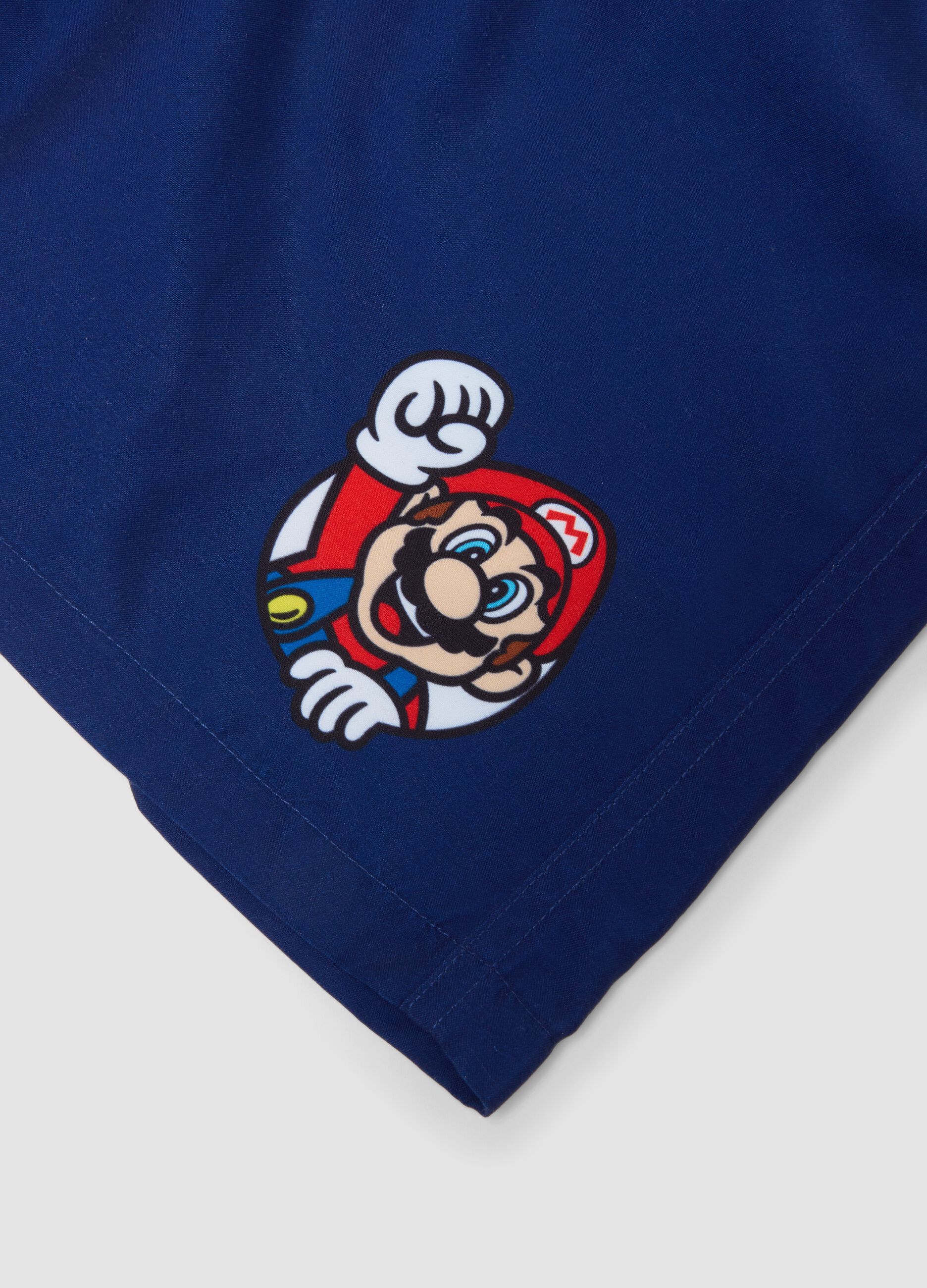 Blue regular fit swim trunks with Super Mario print