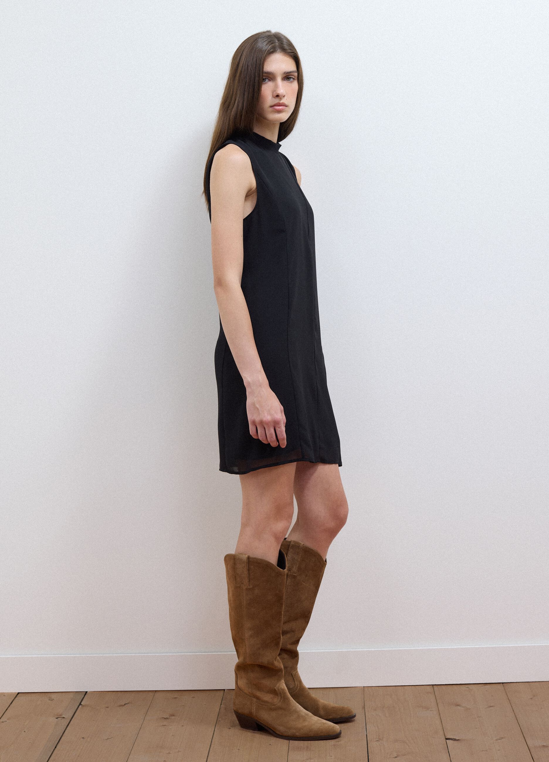 Black sleeveless high-neck slim-fit dress with bow