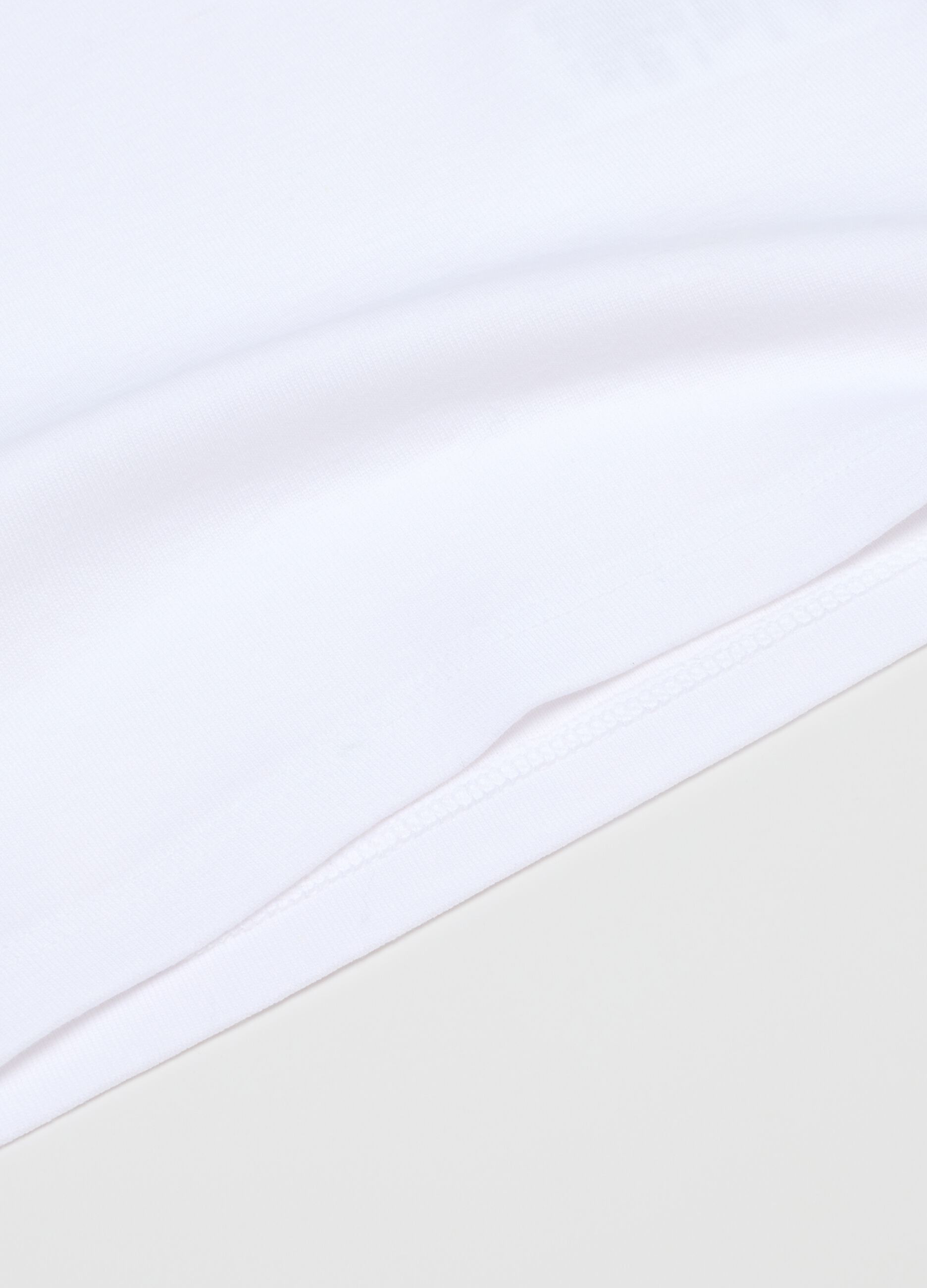 Twin pack of white girls' vests in pure cotton regular fit