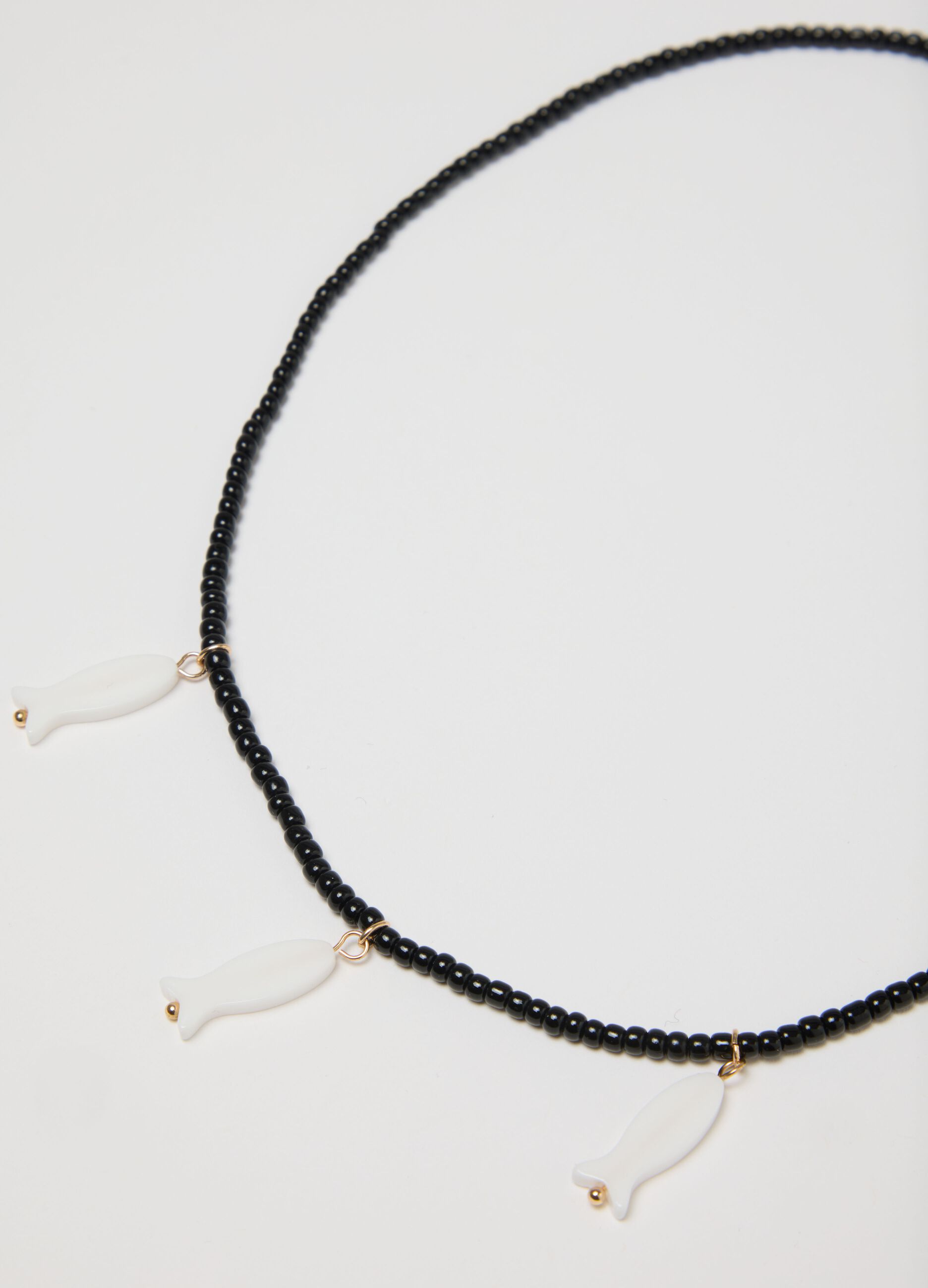 Double-strand beaded necklace with charms