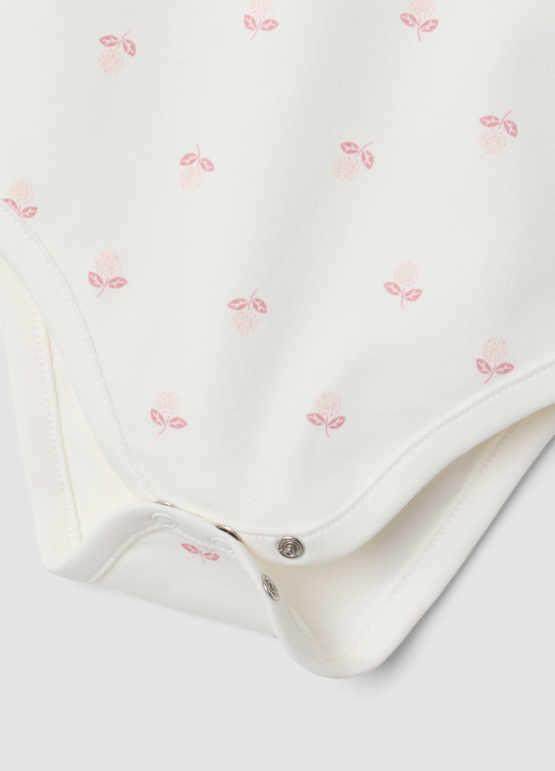 2-pack white organic cotton crew-neck bodysuits for baby girl
