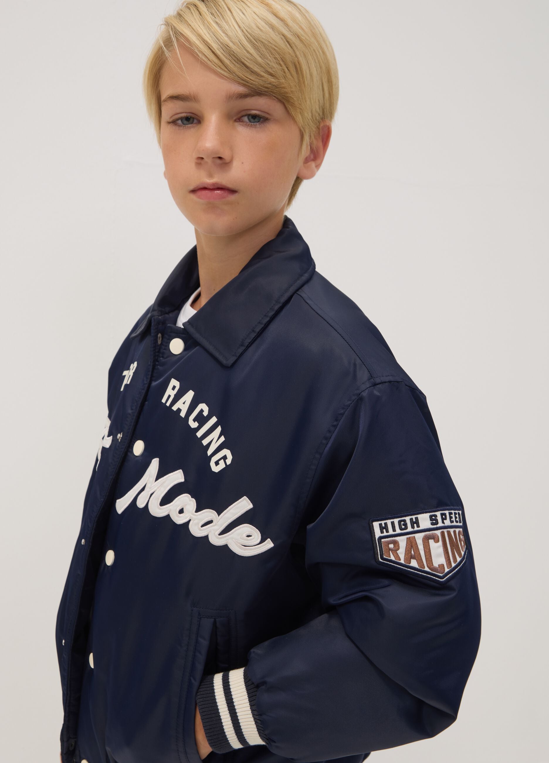 Blue varsity jacket with zip and racing print