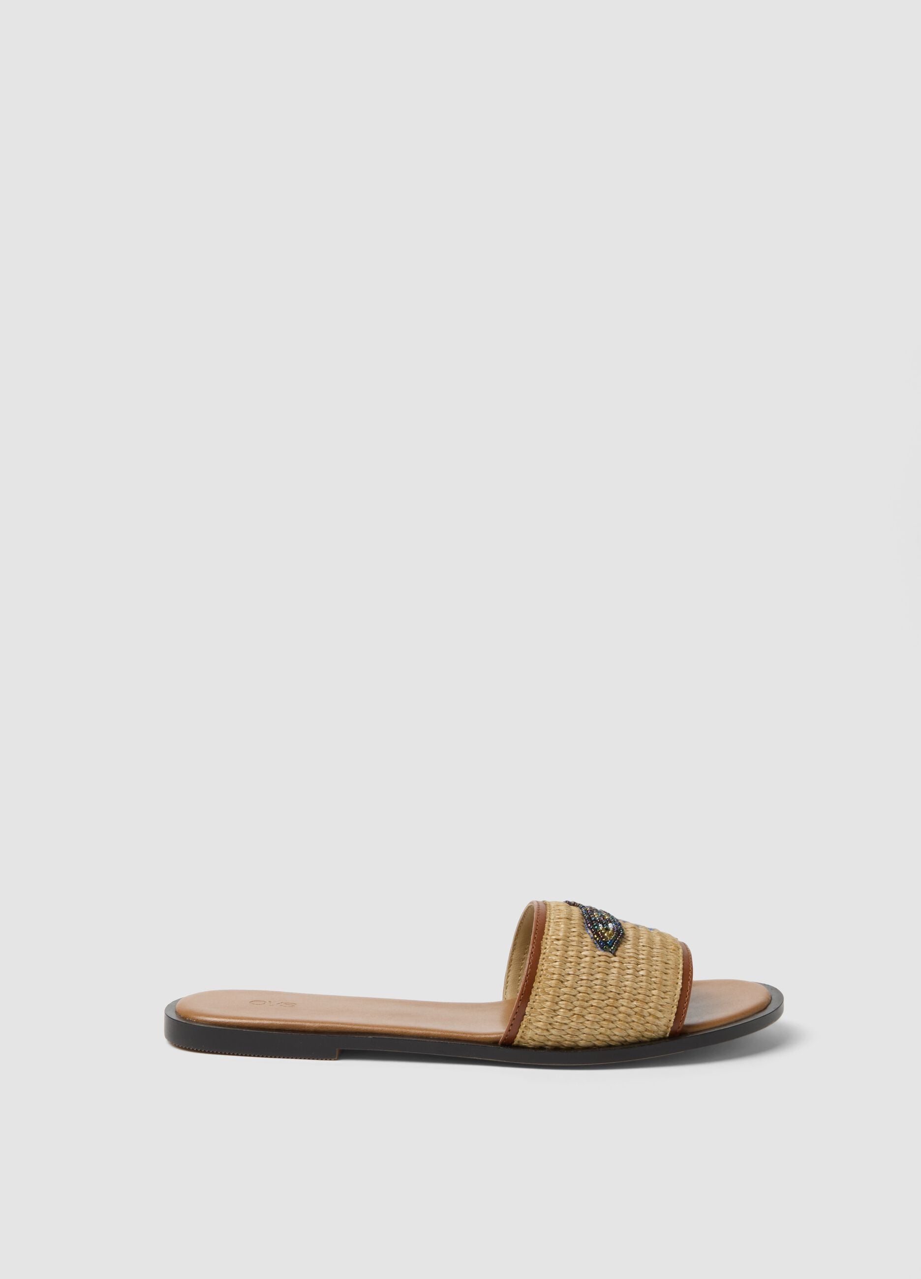 Beige flat sandals with braided embroidered strap