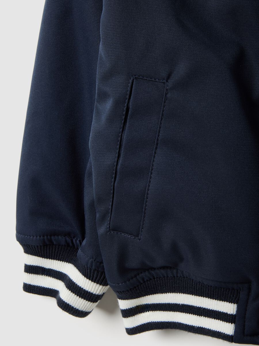Regular fit blue jacket with striped cuffs for boys_3