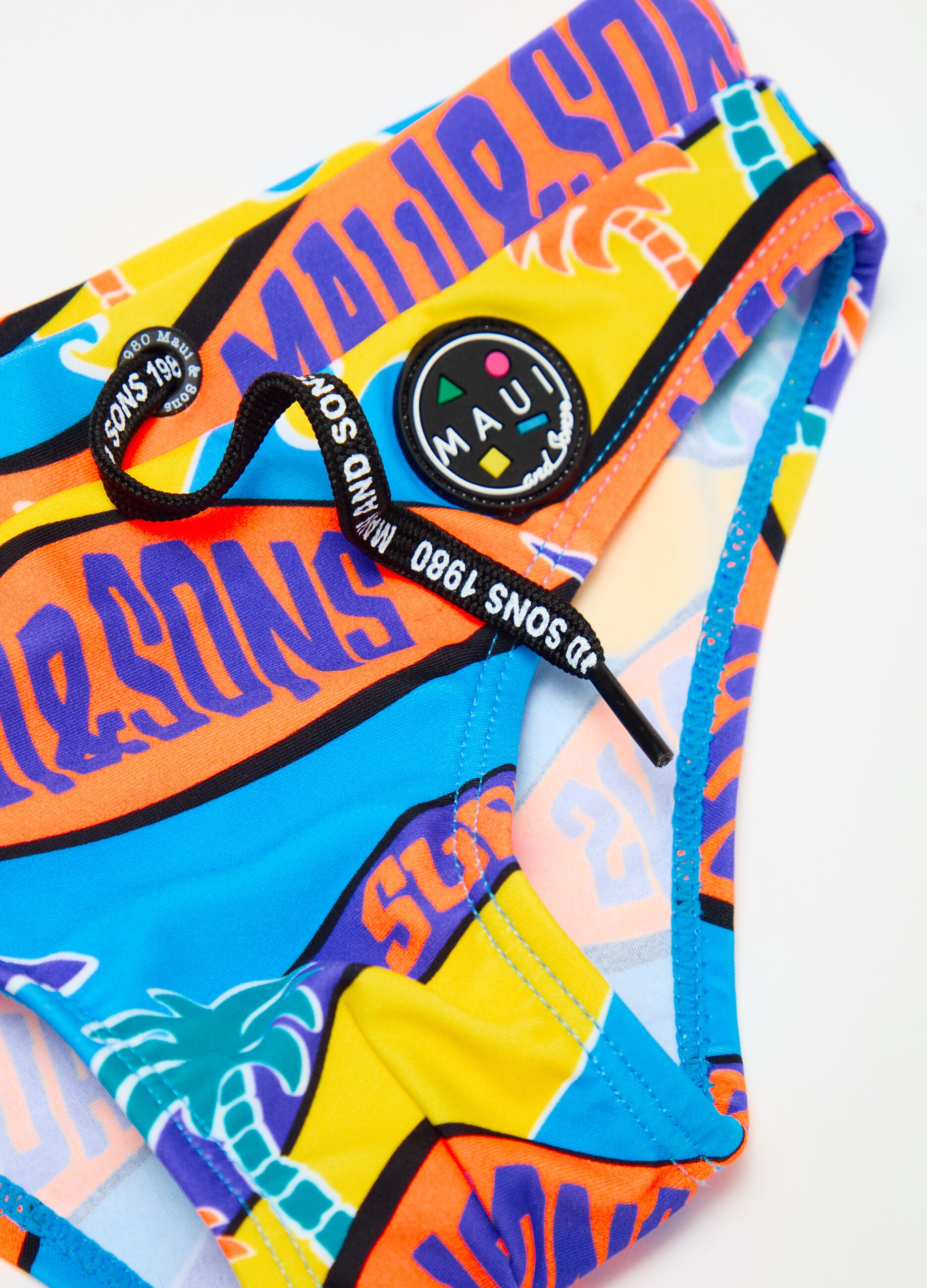 Swim briefs with multicoloured surf print