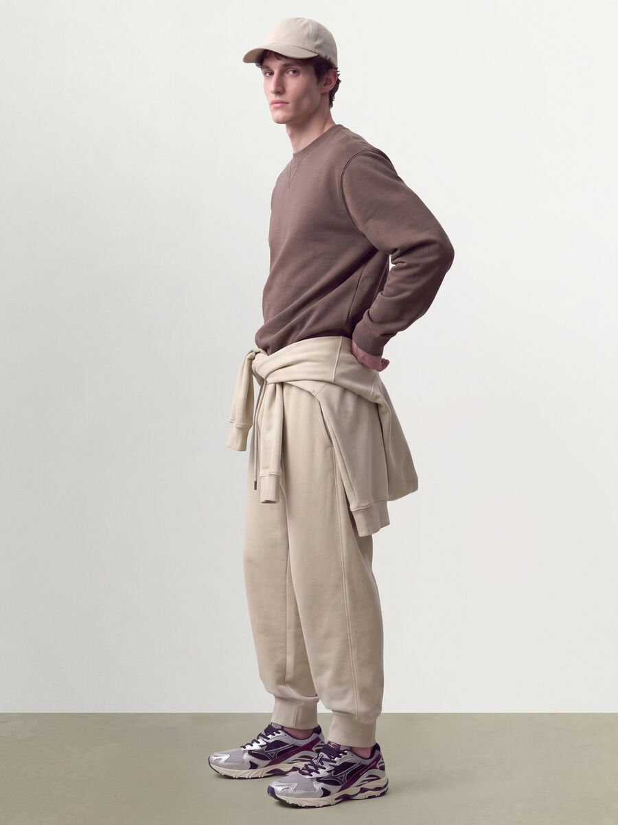 Beige cotton-blend joggers with cuffed hems and drawstring_0