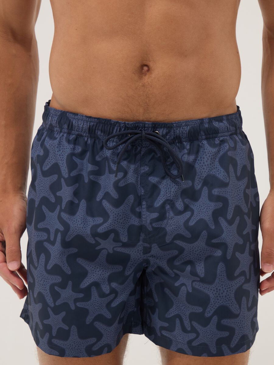 Blue swim shorts with starfish print_1