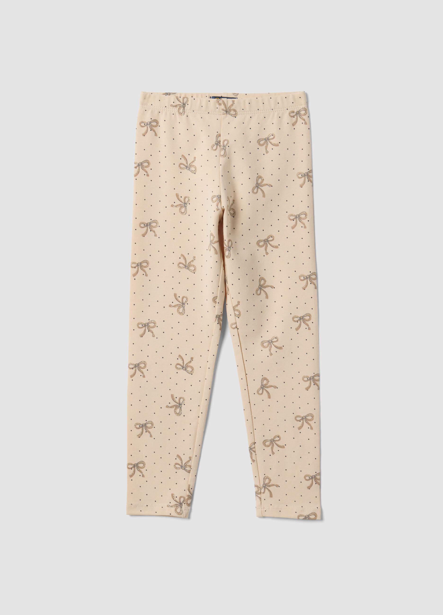 Leggings skinny beige in cotone organico elasticizzato con fiocchi per bambina