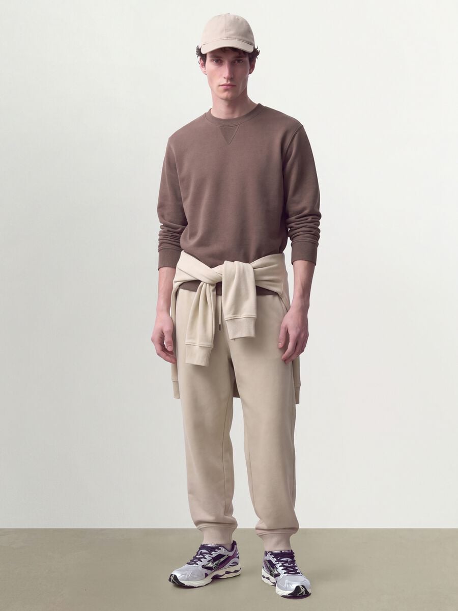 Beige cotton-blend joggers with cuffed hems and drawstring_1