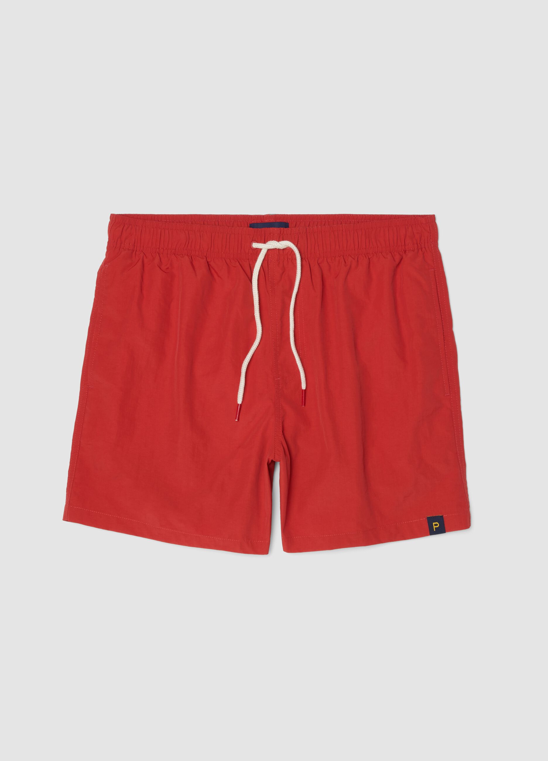 Red swim shorts with elasticated waistband and drawstring