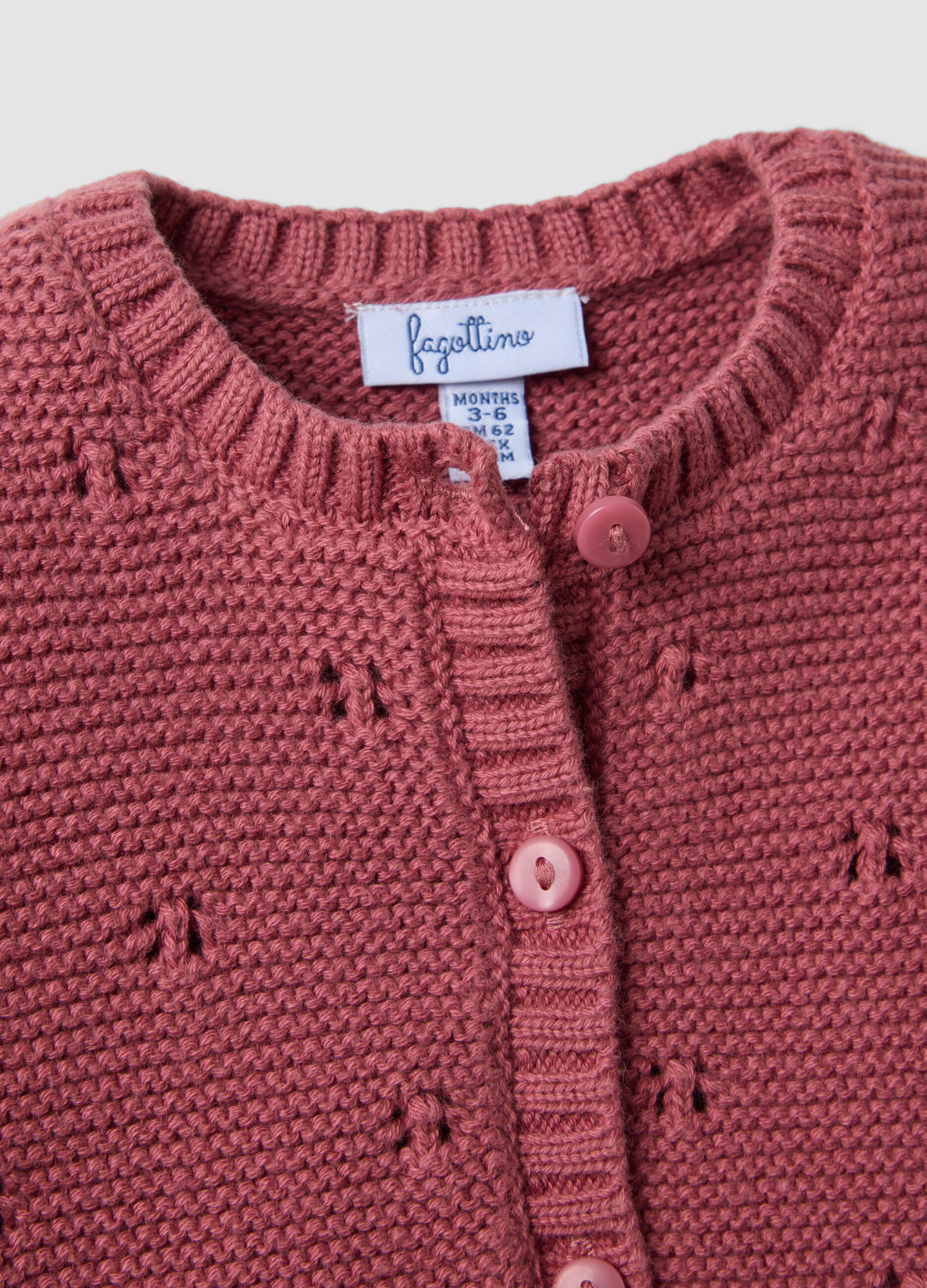 Completo rosa in puro cotone organico in maglia traforata per neonata