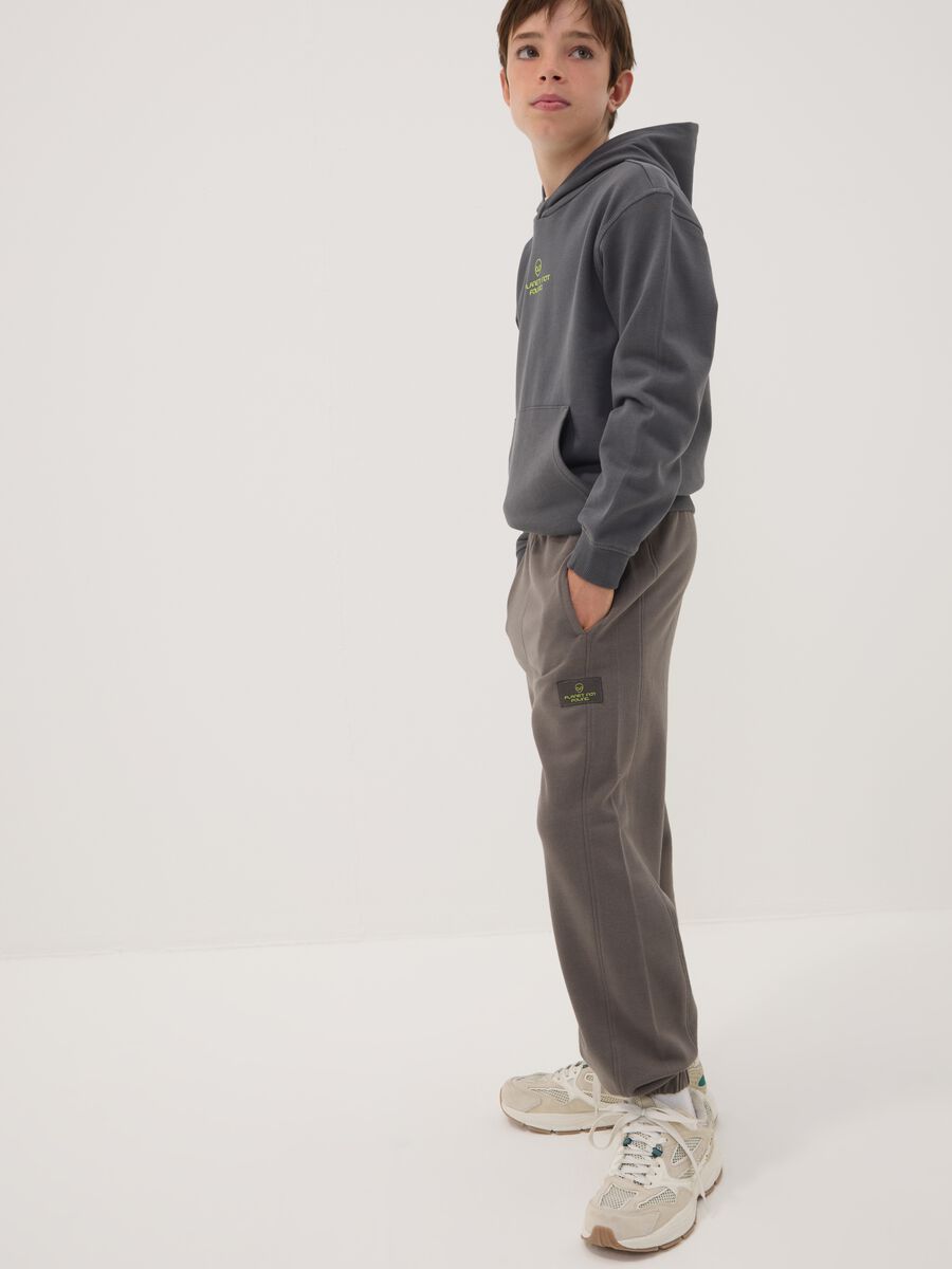 Cal&ccedil;as jogger cinzentas em algod&atilde;o puro, corte oversized, para rapaz_1