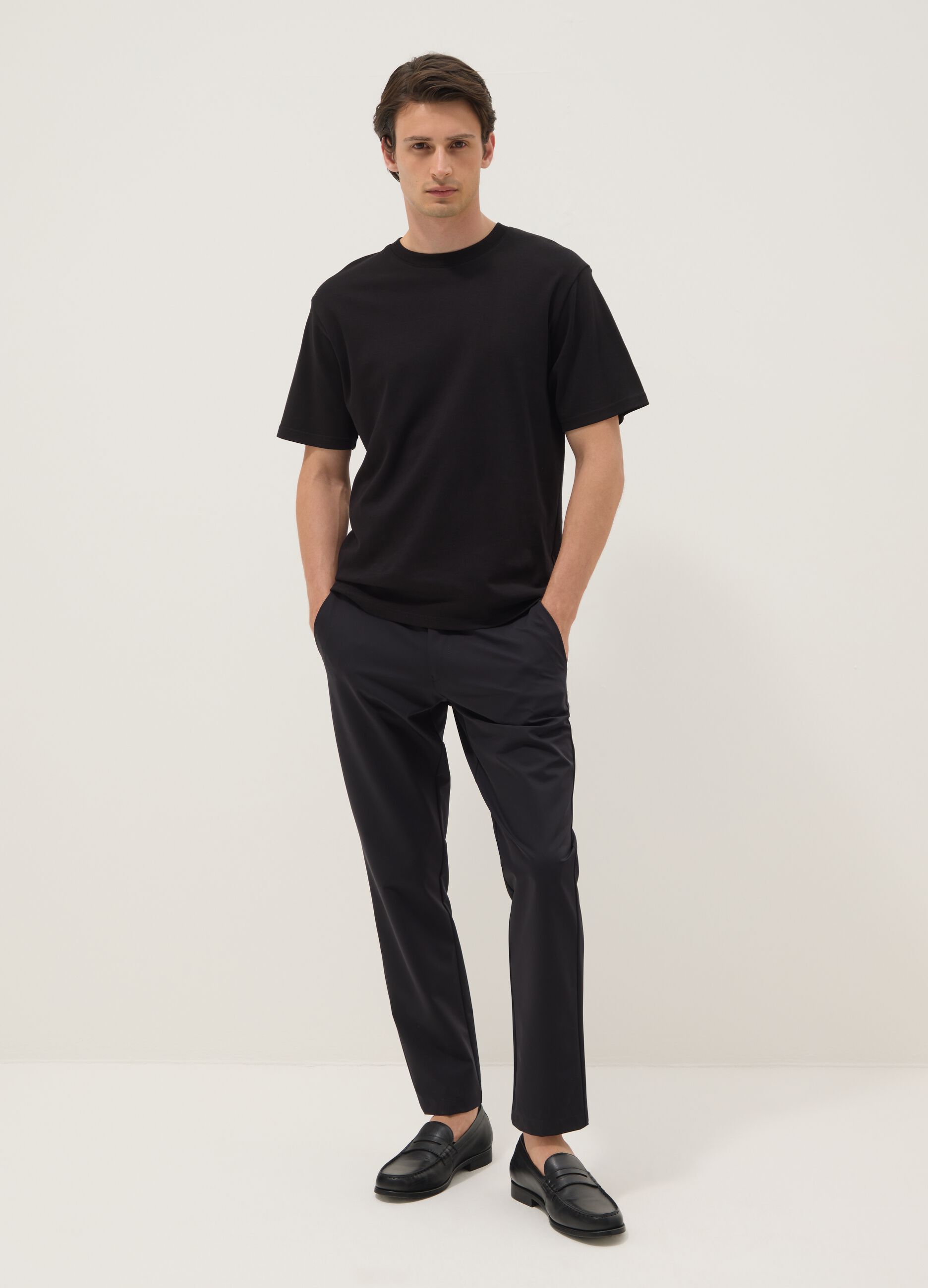 Black stretch carrot-fit chino trousers