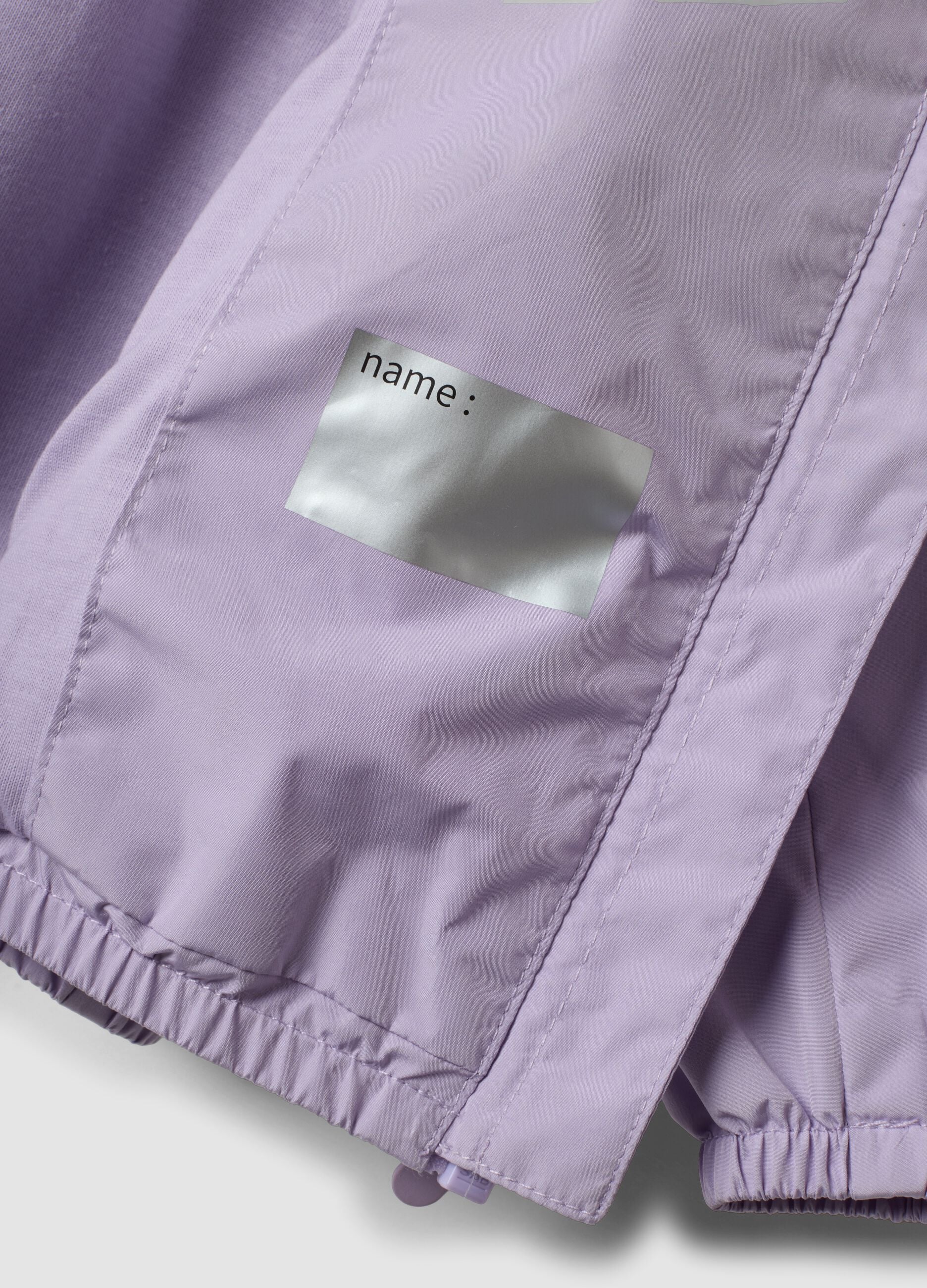 Giacca antipioggia viola con cappuccio e zip per bimba