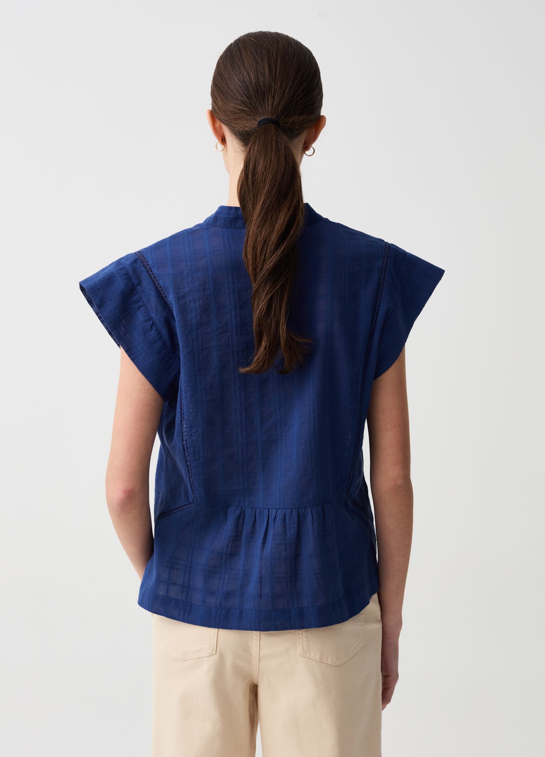 Blouse with check design and à jour embroidery
