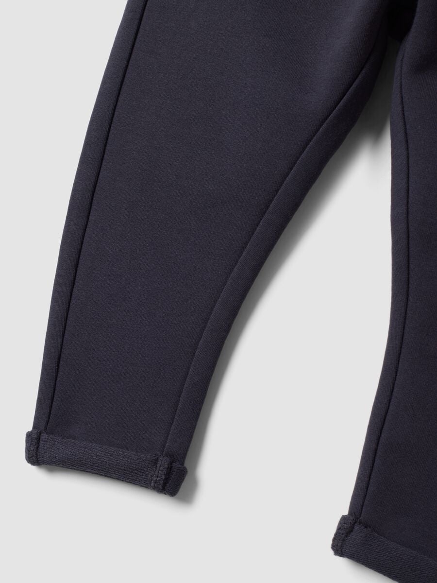 Grey stretch cotton joggers with turn-up cuffs for baby girl_3