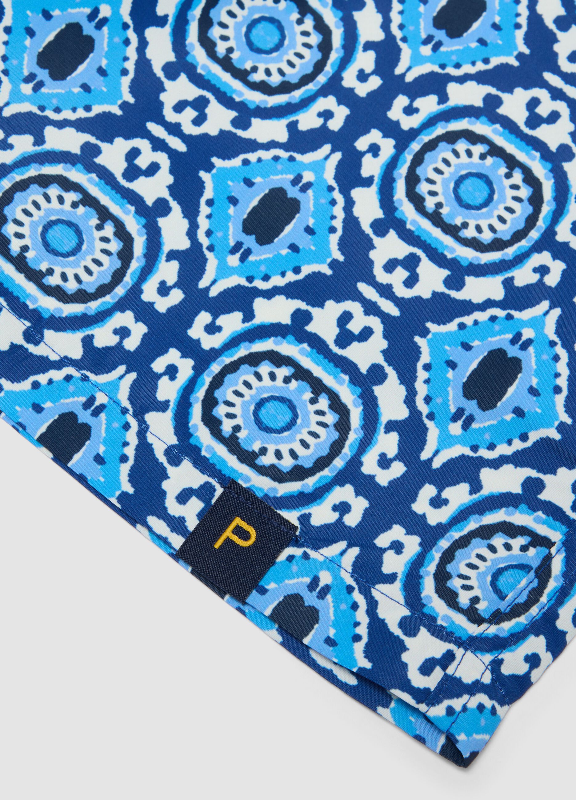 Blue patterned swim shorts