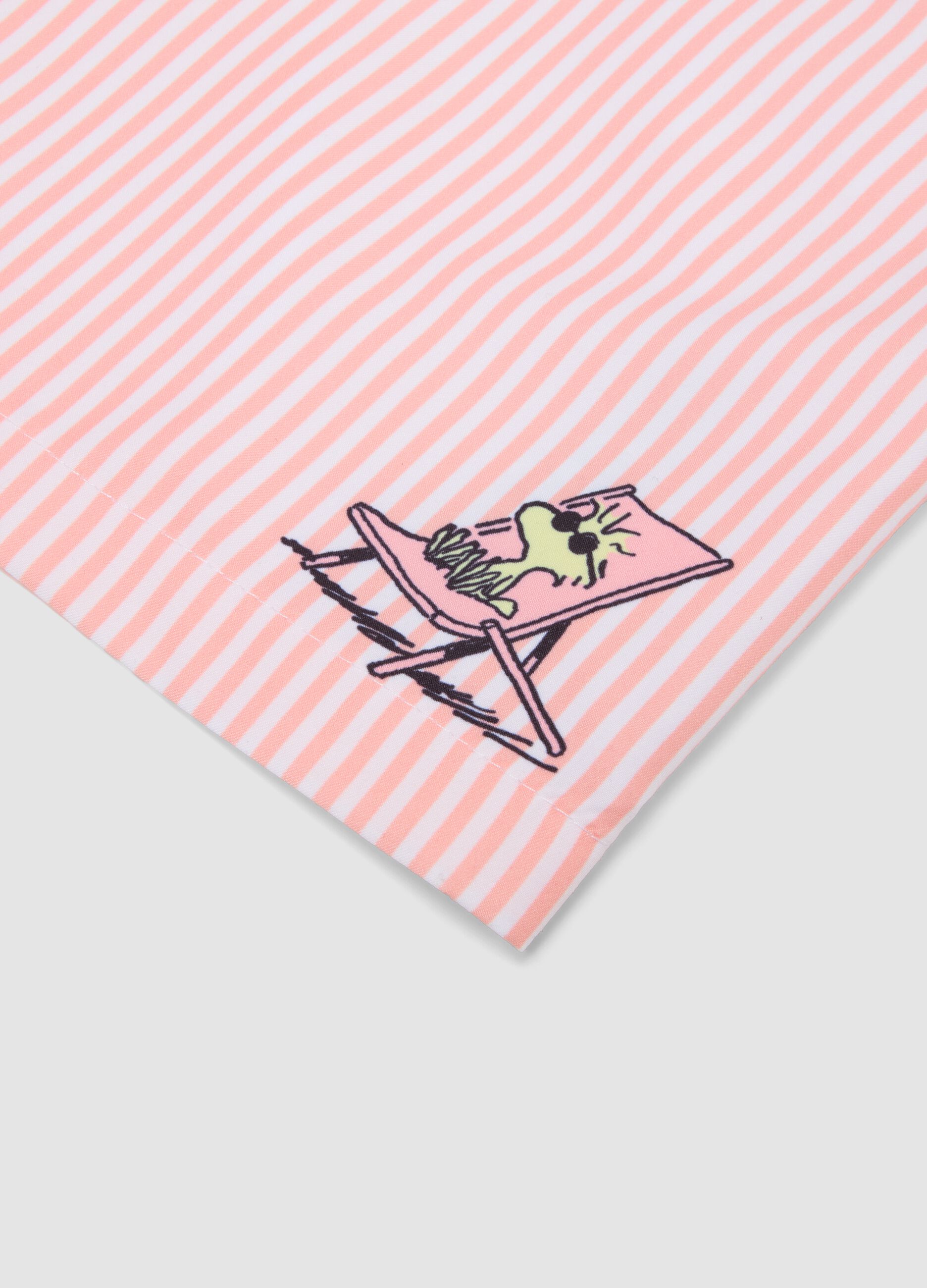 White and pink striped swim trunks with Peanuts print