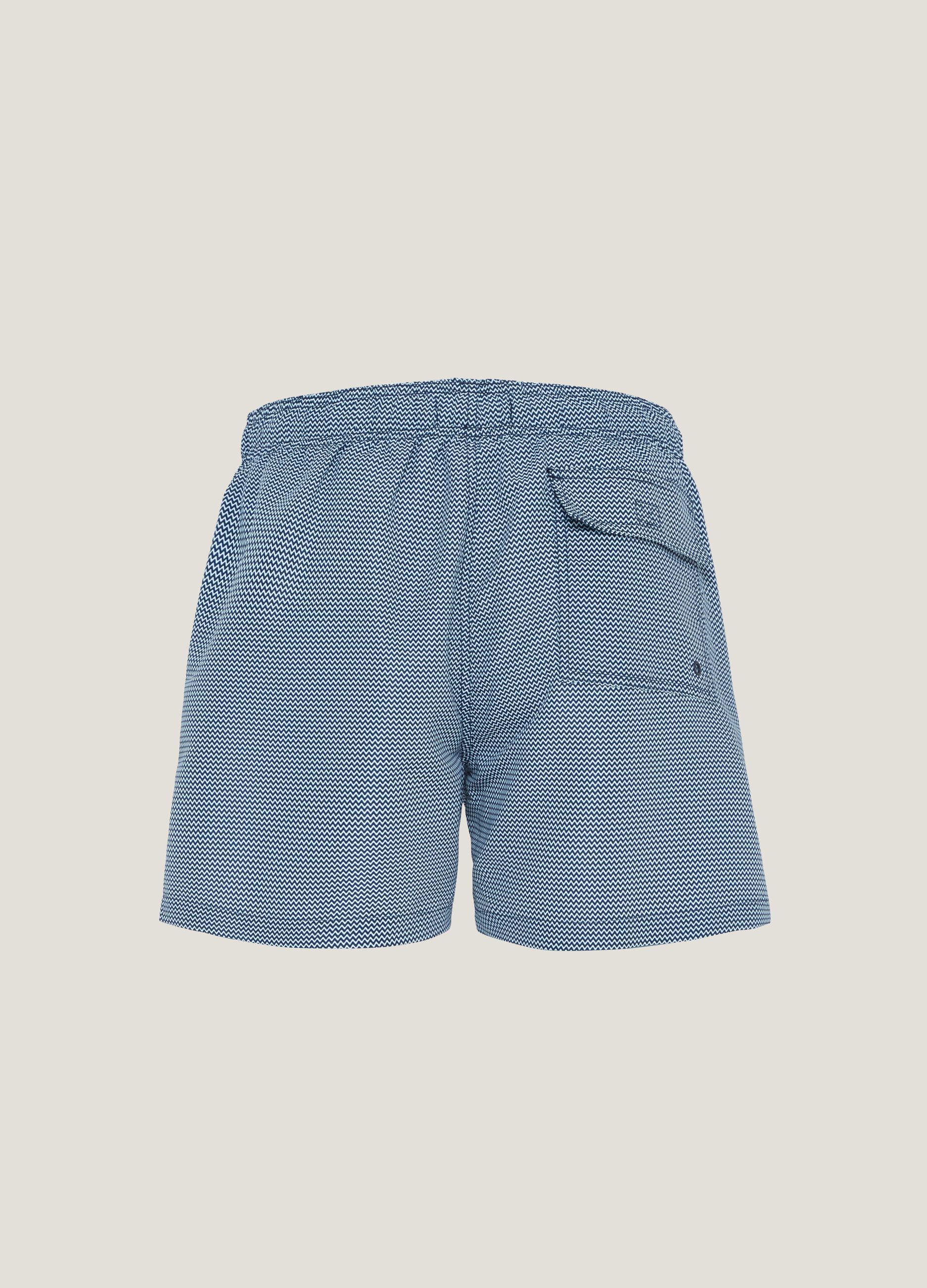 Swimming trunks with waves pattern